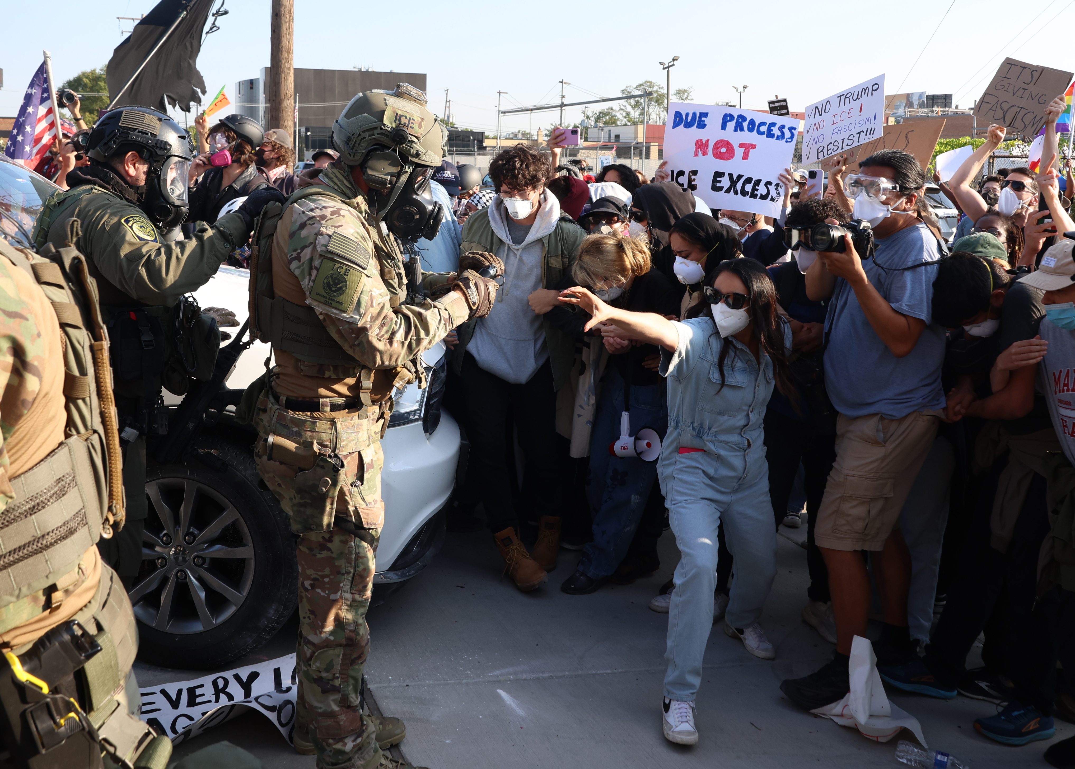 Federal officers clear protesters from the entrance of the U.S....