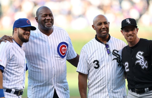 Former Chicago Cubs player Lee Smith, second from left, and former Chicago White Sox player Harold Baines, second from right, pose for photographs after both threw out ceremonial first pitches before the game between the two teams at Wrigley Field in Chicago on June 18, 2019. (Chris Sweda/Chicago Tribune)