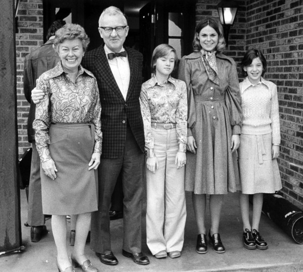 Judge John Paul Stevens stands with his wife Elizabeth, left, and daughters Elizabeth, 14, Kathryn Jedlicka, 24, and Susan, 12, right, in front of their home at 8118 S. Garfield Avenue in Burr Ridge on Nov. 29, 1975. (Ray Gora/Chicago Tribune)