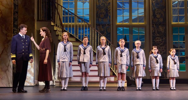Kevin Earley (Captain von Trapp) and Cayleigh Capaldi (Maria Rainer) with the von Trapp children Ariana Ferch (Liesl, from left), Eli Vander Griend (Friedrich), Ava Davis (Louisa), Benjamin Stasiek (Kurt), Haddie Mac (Brigitta), Ruby Caramore (Marta) and Luciana VanDette (Gretl) in "The Sound of Music" at the Nederlander Theatre. (Jeremy Daniel)