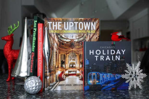 "Lee Friedlander: Christmas," by Lee Friedlander, "Norman Rockwell's Christmas," by Norman Rockwell, "The Uptown: Chicago's Endangered Movie Palace," by Robert Loerzel and James A. Pierce and "Chicago's Holiday Train," by Daniel Moreno. (Stacey Wescott/Chicago Tribune)
