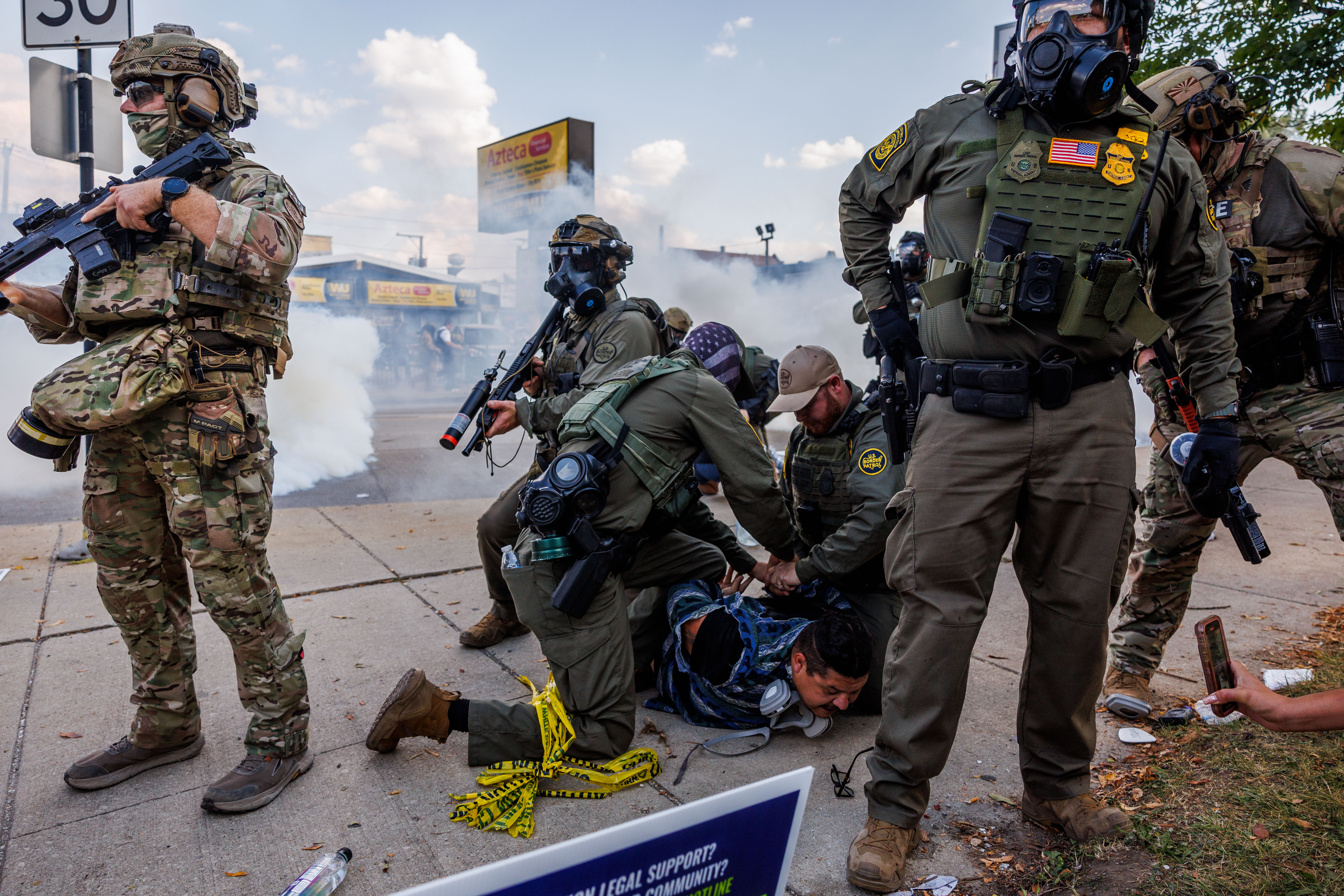 Federal officers detain a person near the 3900 block of...
