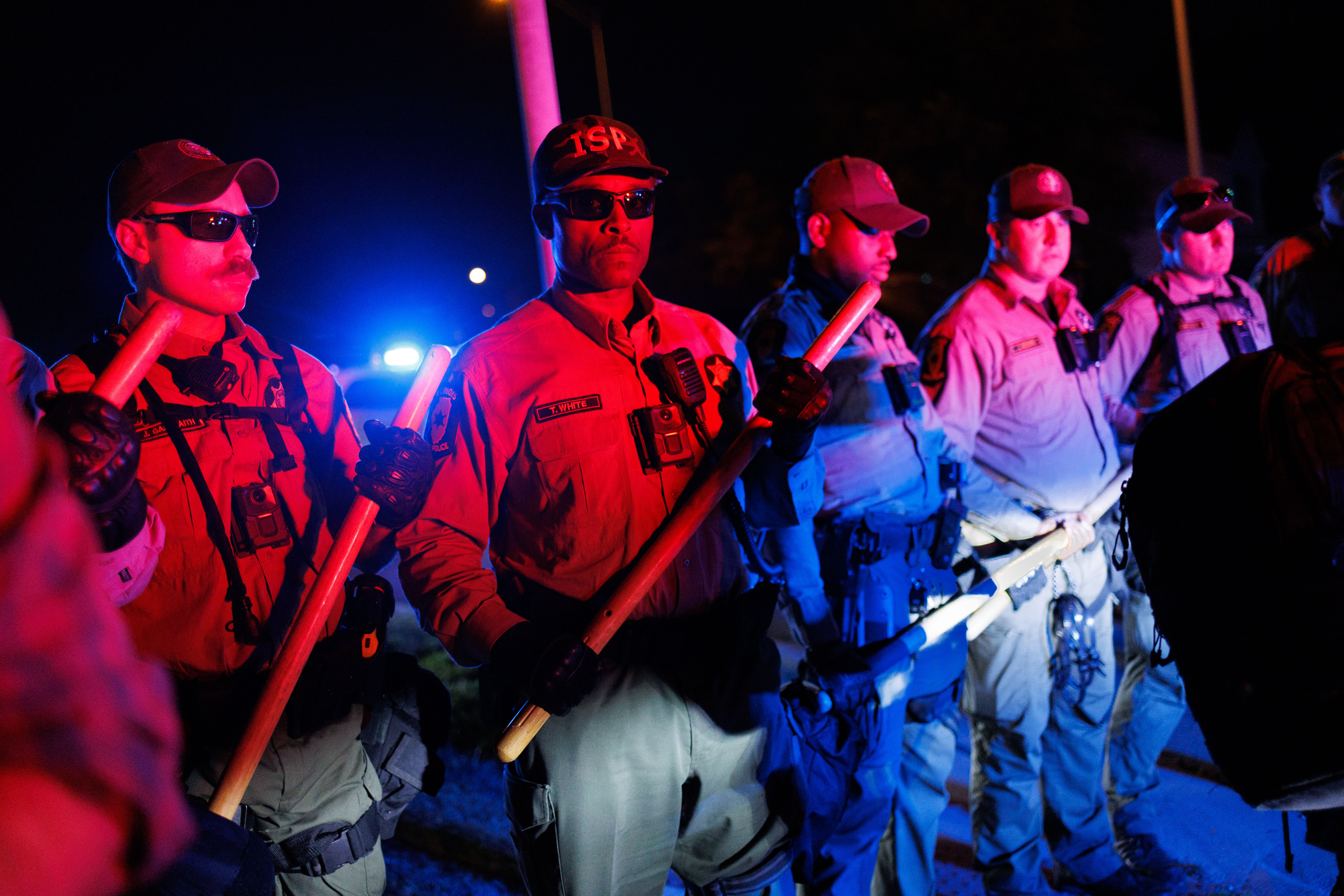 Illinois State Police hold a line near the U.S. Immigration...