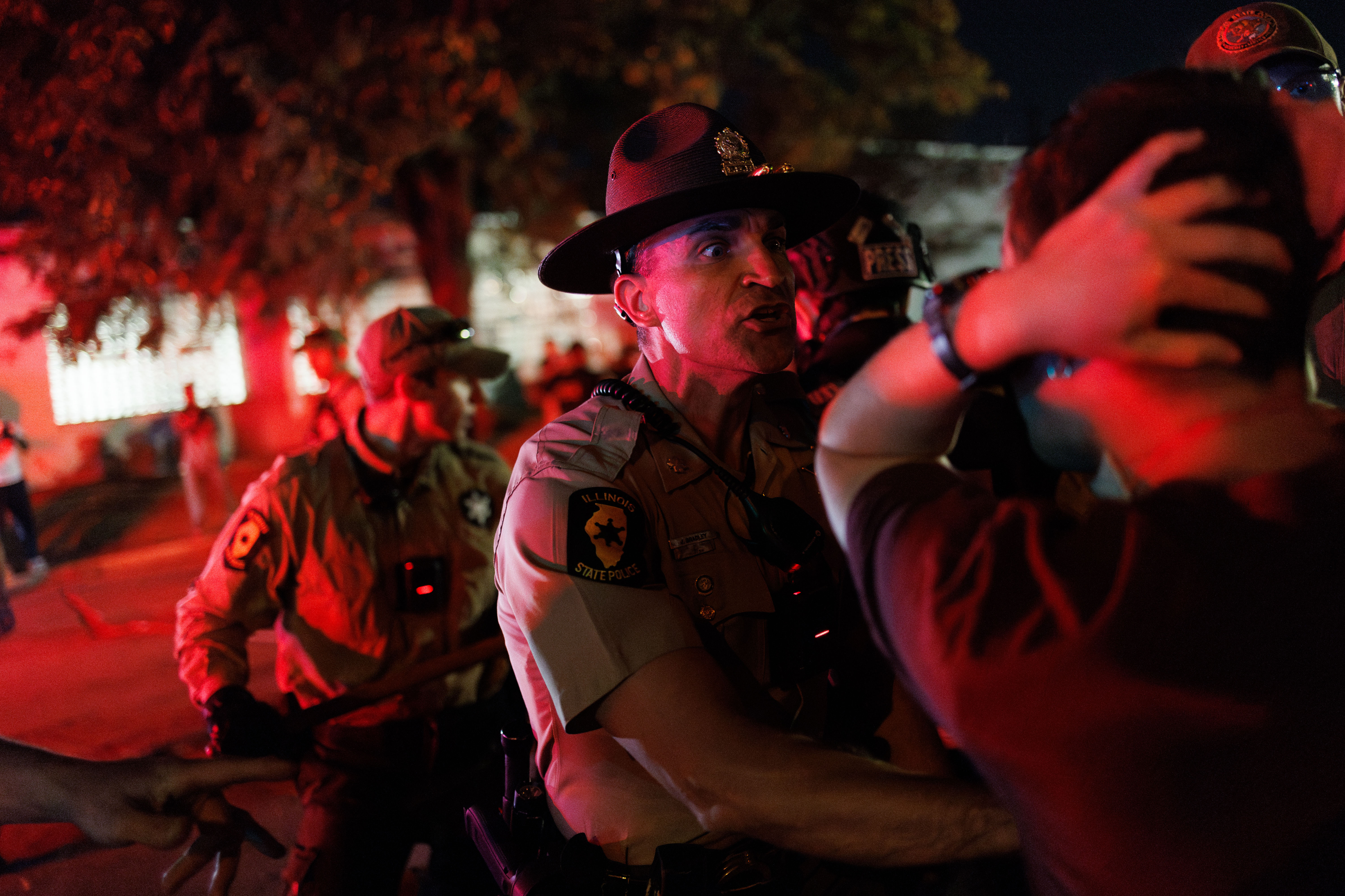 Illinois State Police move protesters back near the U.S. Immigration...