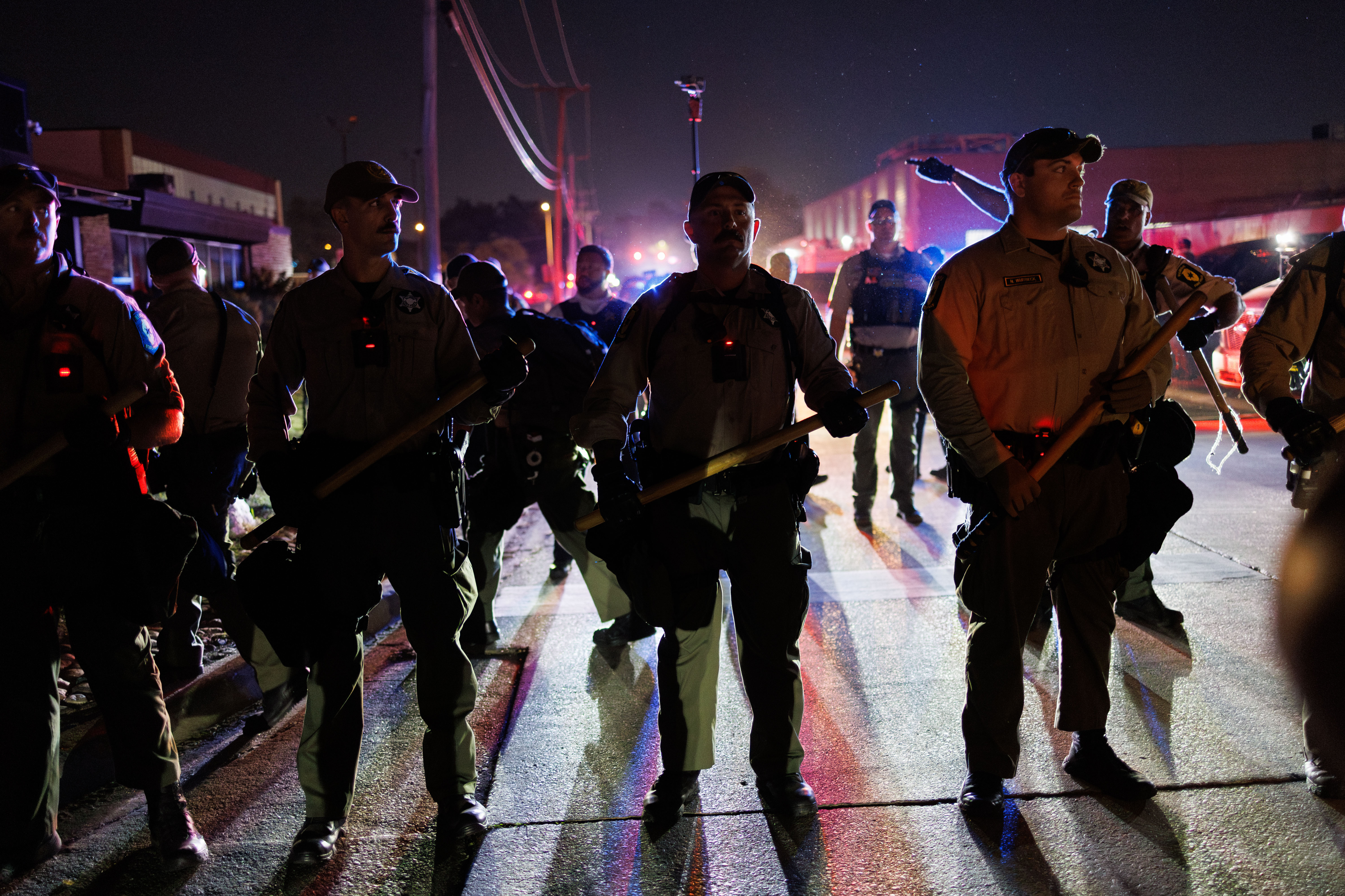 Illinois State Police move protesters off the road while they...