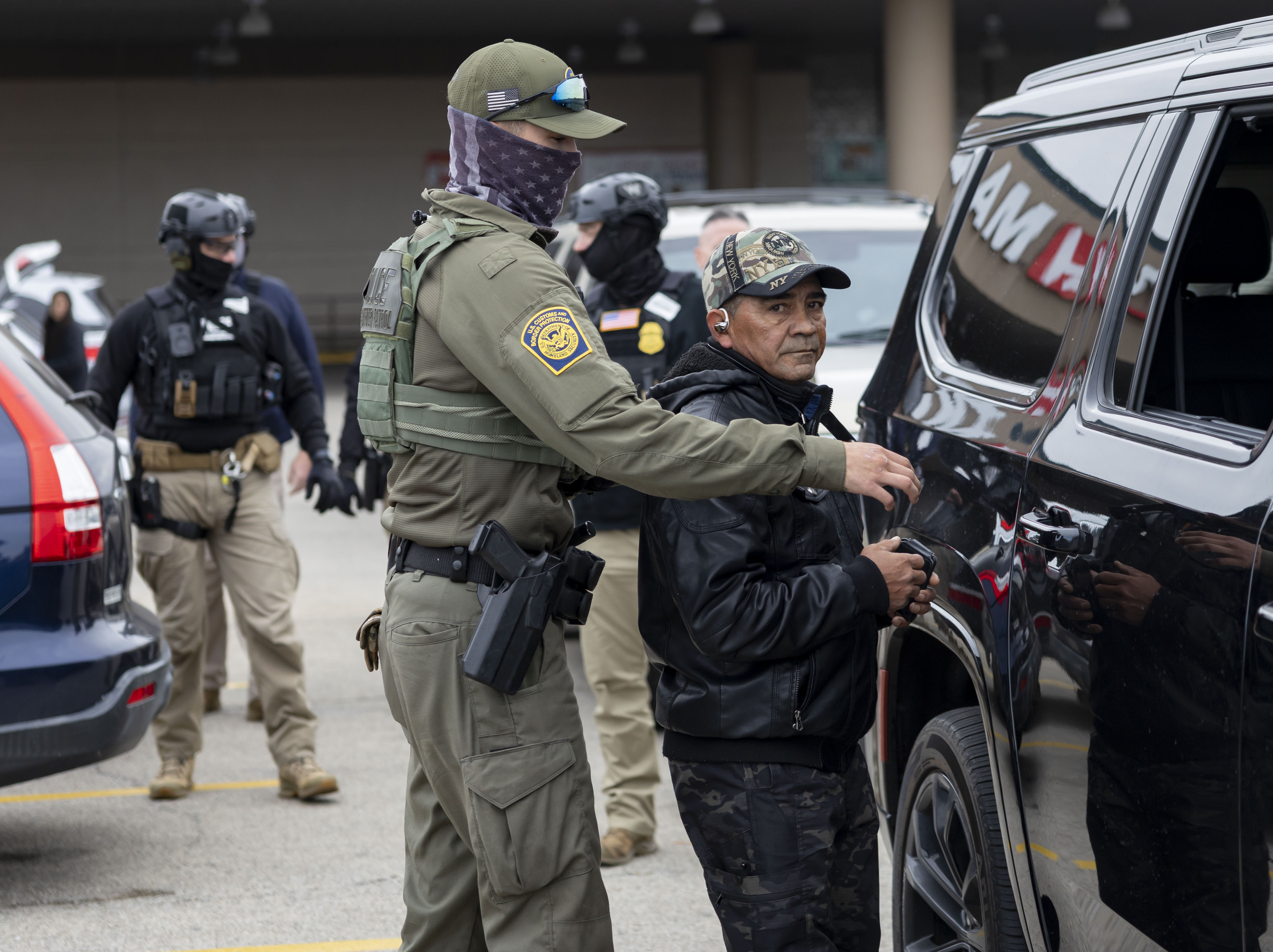 U.S. Border Patrol agents detain a man they found in...