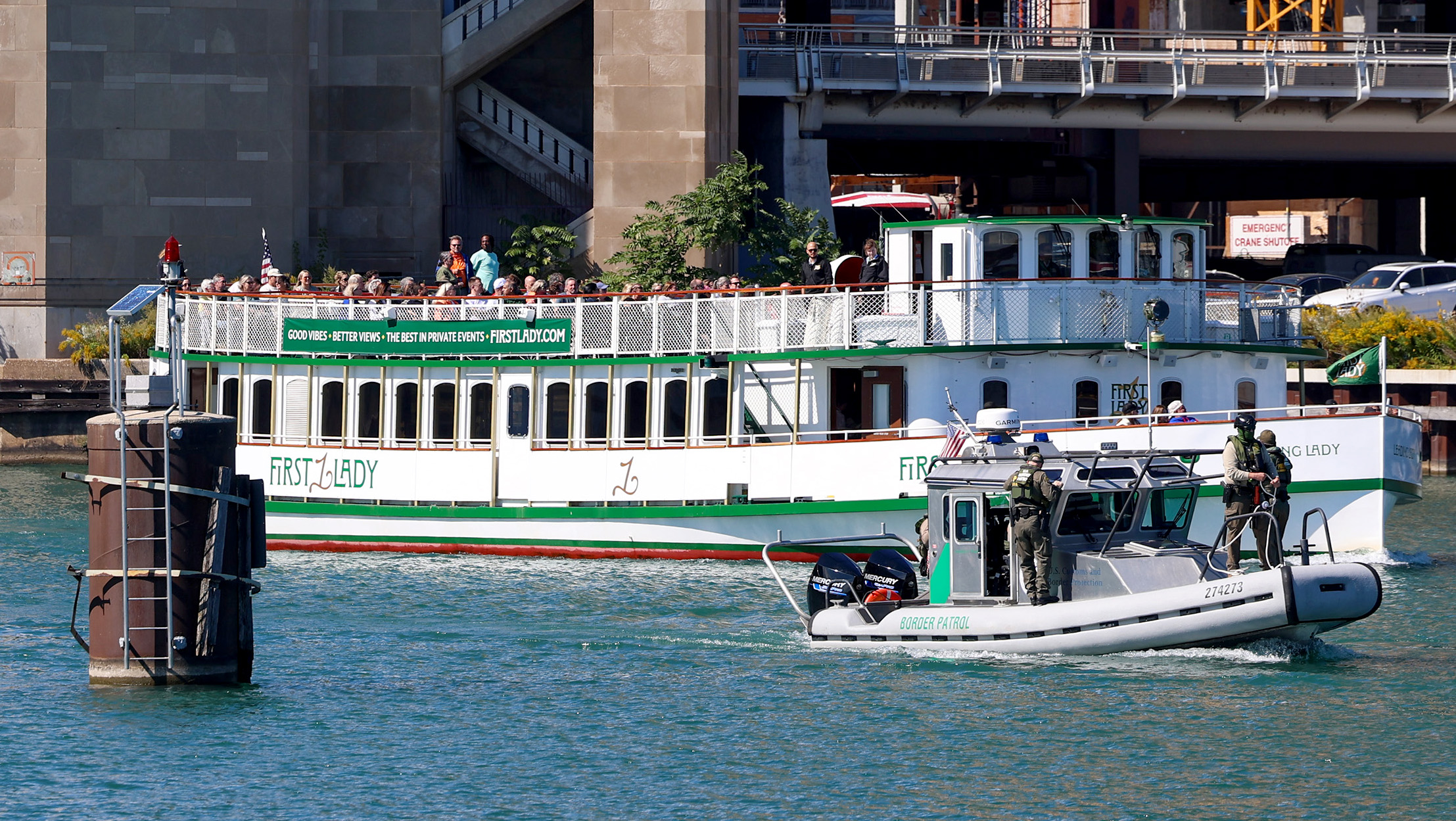 A U.S. Border Patrol boat emerges from under the Lake...