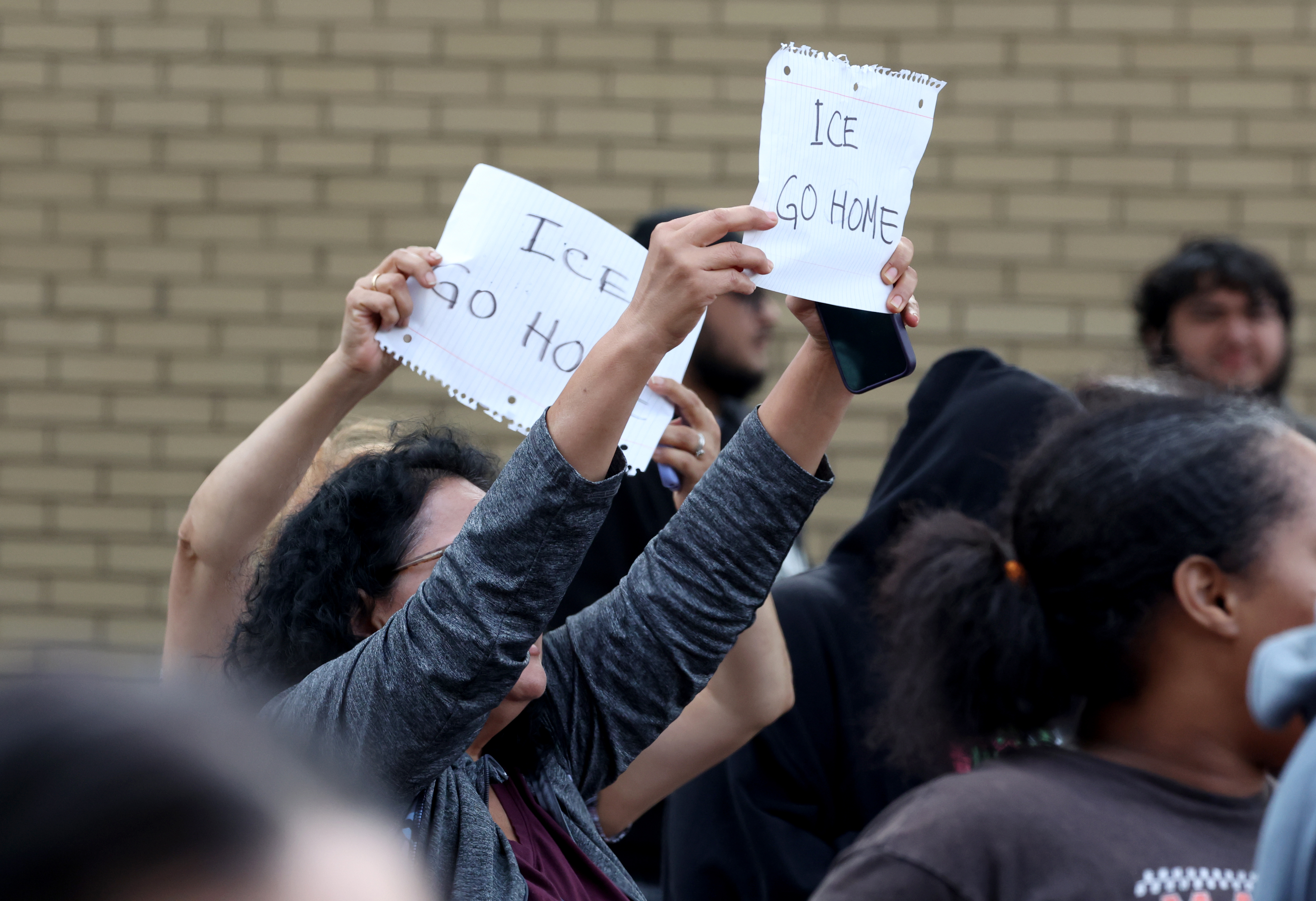 U.S. Border Patrol agents are confronted by community members in...