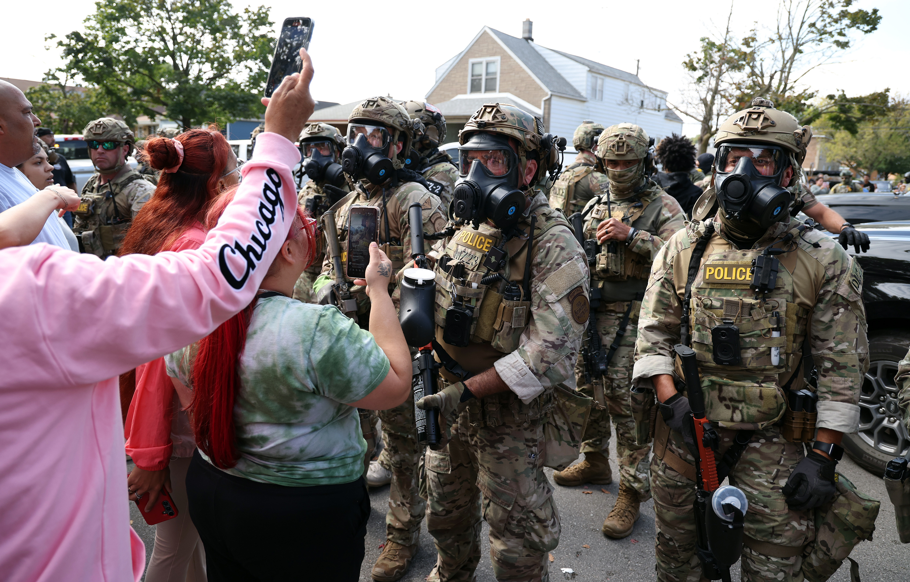 Border Patrol agents face off against community members at 105th...