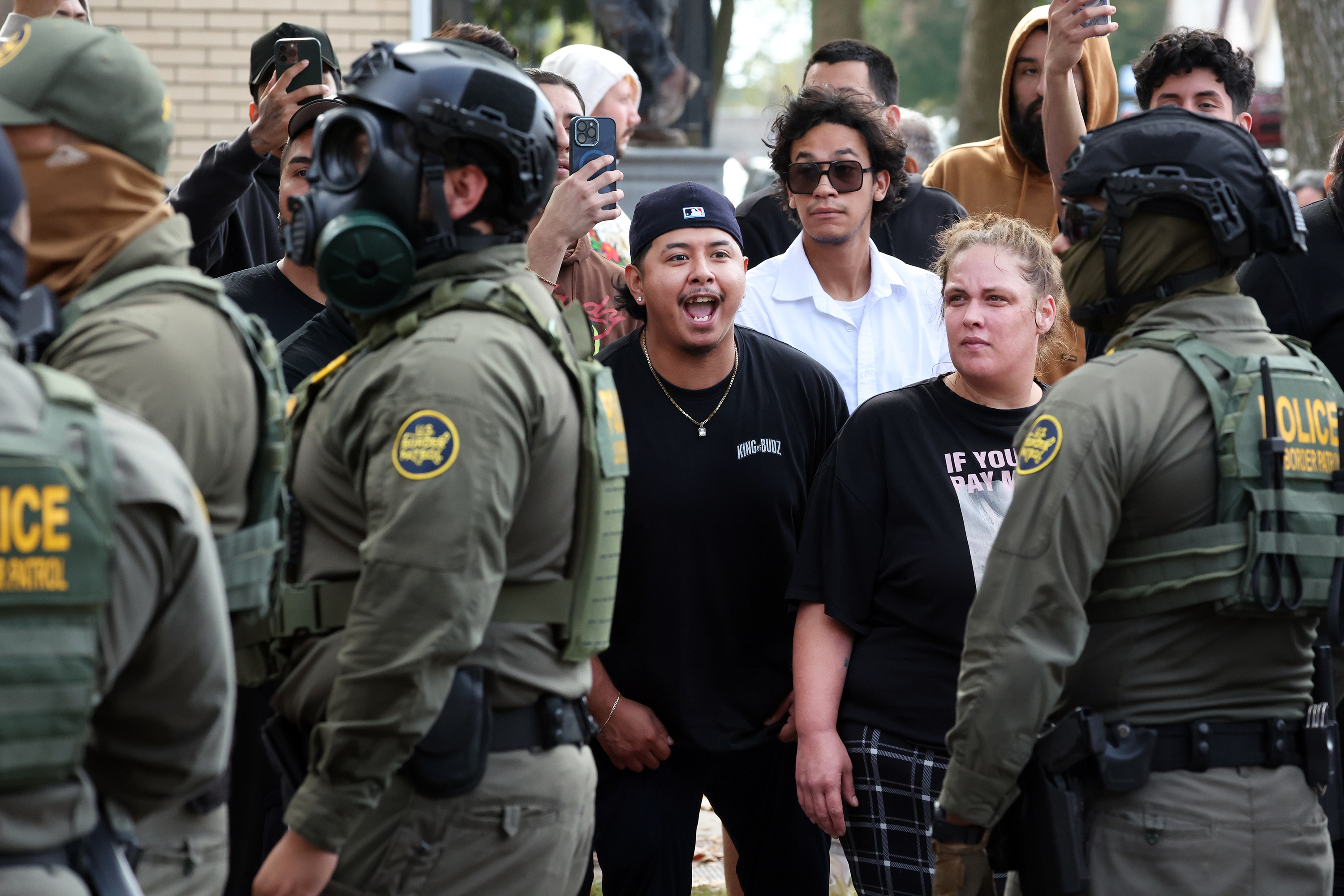 Border Patrol agents face off against community members at 105th...