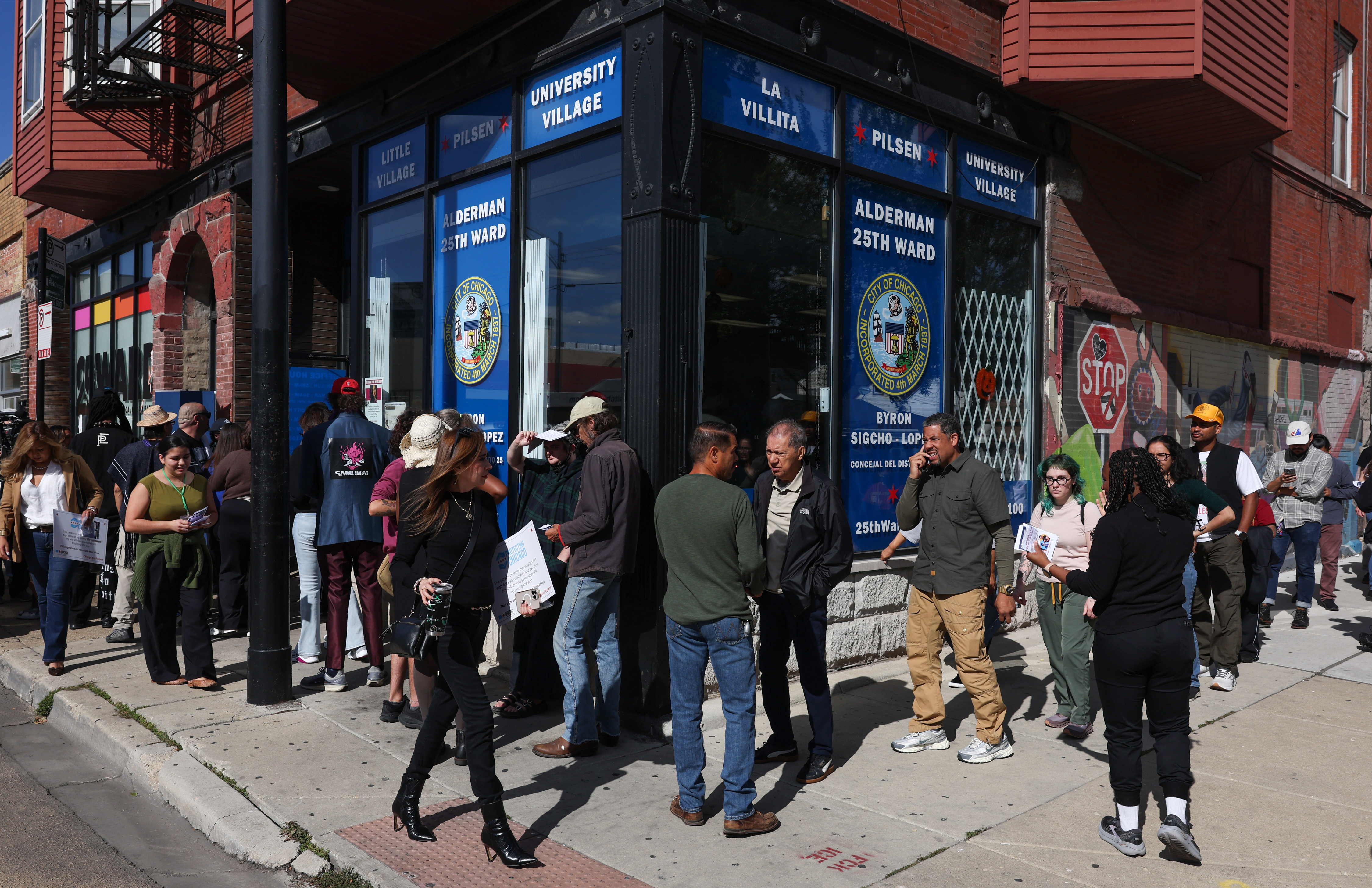 Area residents stand in line to receive 