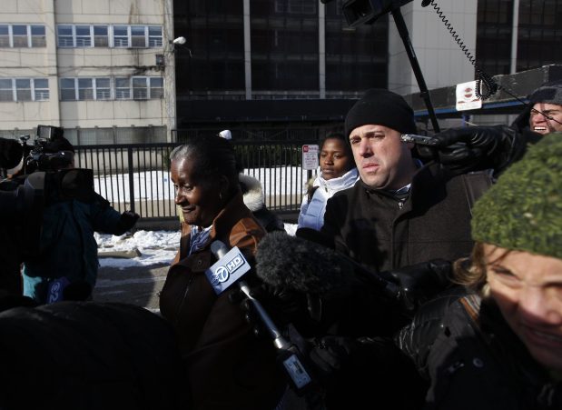 The last resident of the last high-rise building, Annie Ricks, center, is swarmed by the media after she moved out of the Cabrini-Green public housing development on Dec. 9, 2010. (José M. Osorio/Chicago Tribune)
