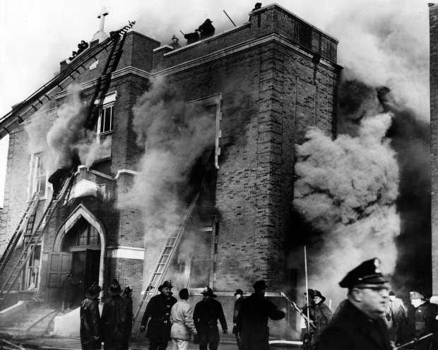 Dense smoke rolls from Our Lady of the Angels school on Dec. 1, 1958, in Chicago. The fire on the city's West Side took the lives of 92 children and three nuns. It remains one of the worst tragedies in Chicago's history. (Chicago Tribune historical photo)