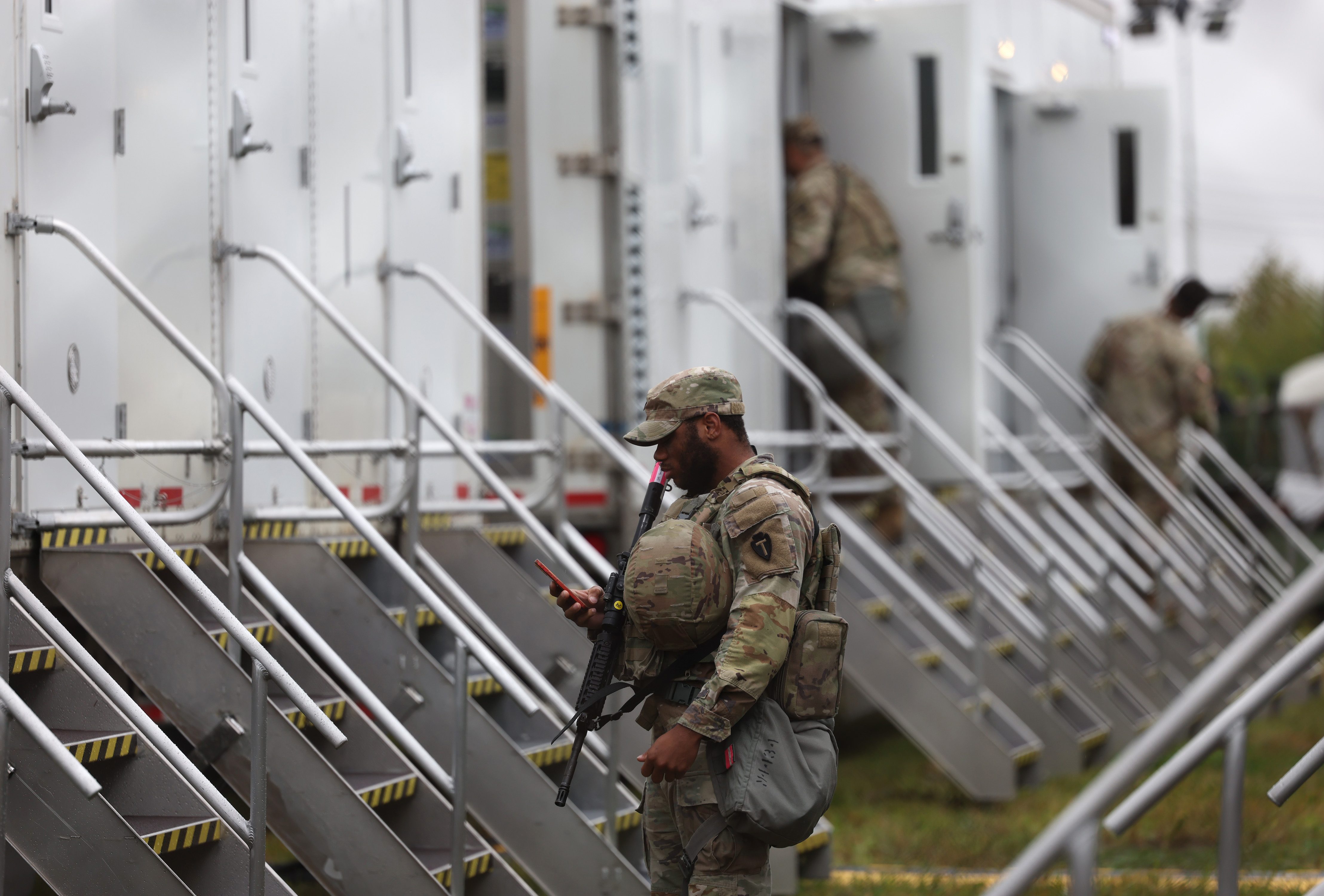 Members of the Texas National Guard assemble at the Army...