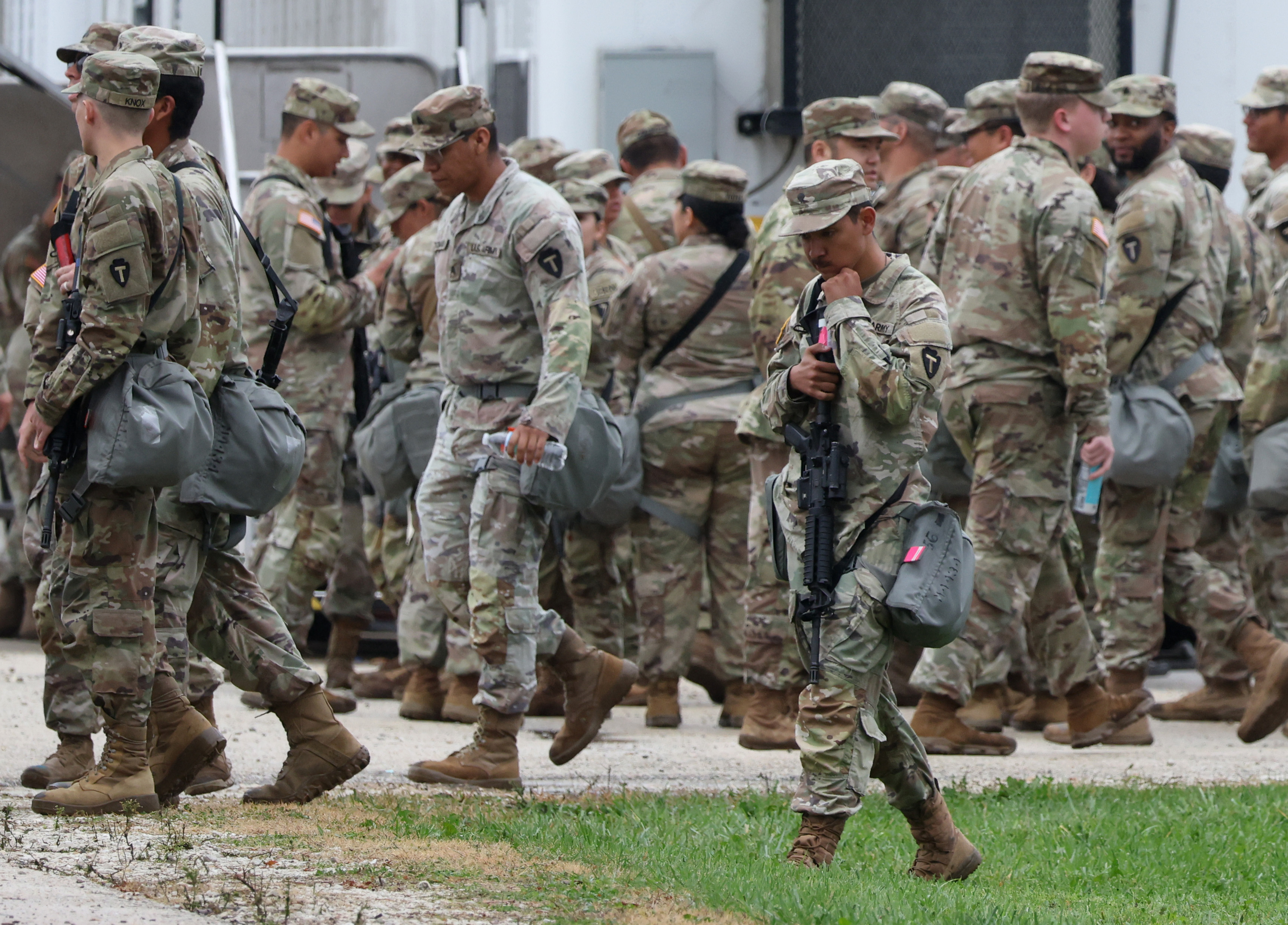 Members of the Texas National Guard assemble at the Army...