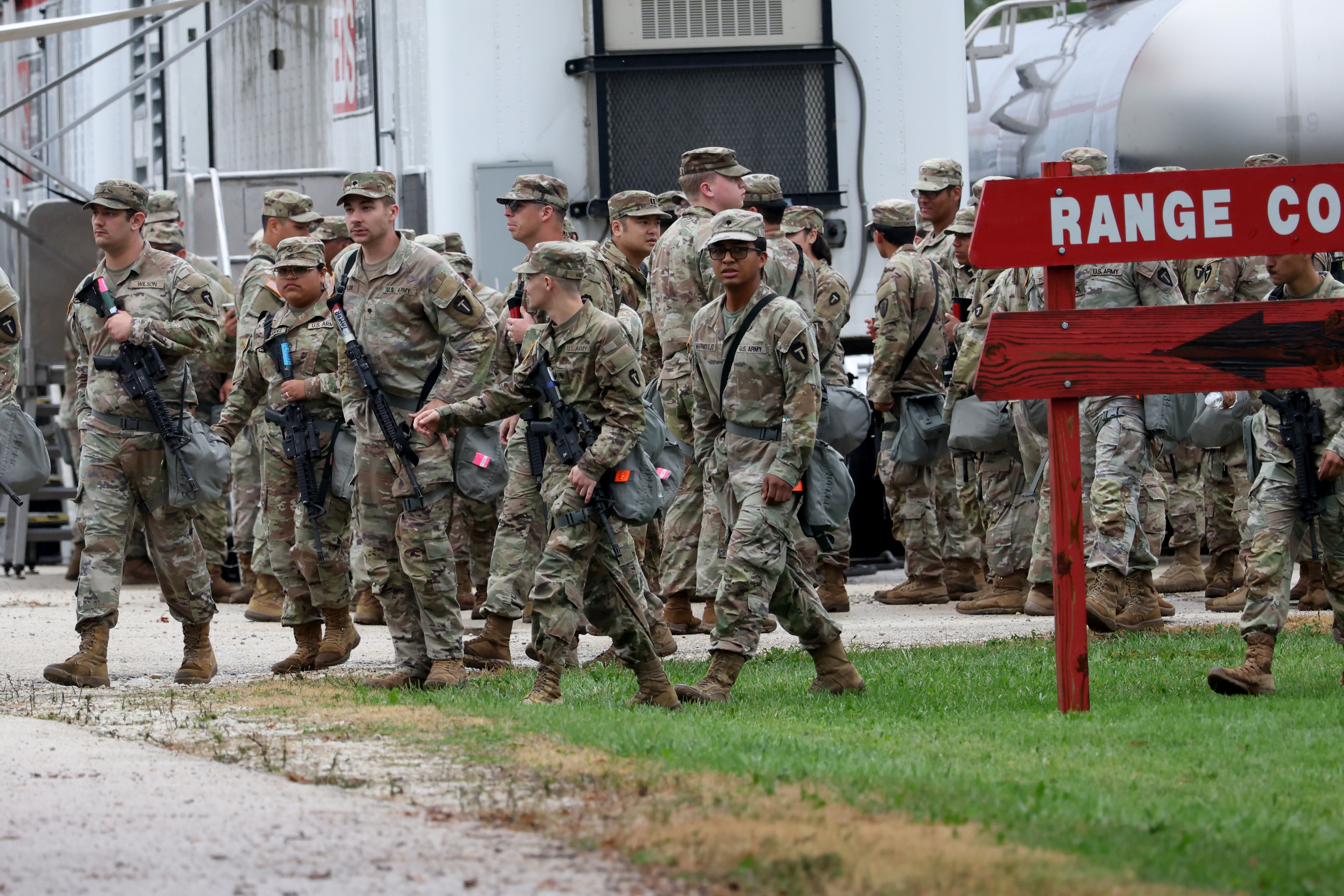 Members of the Texas National Guard assemble at the Army...