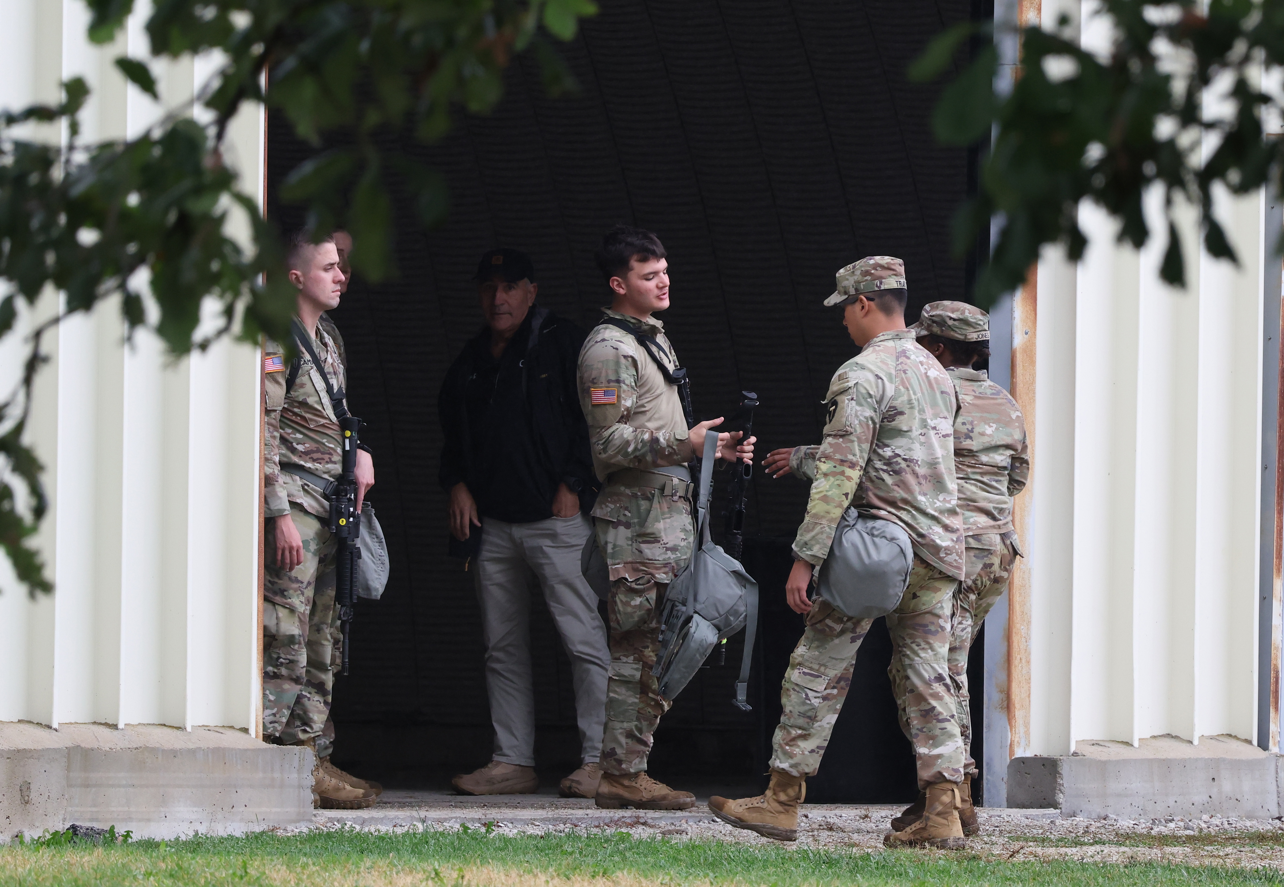 Members of the Texas National Guard assemble at the Army...