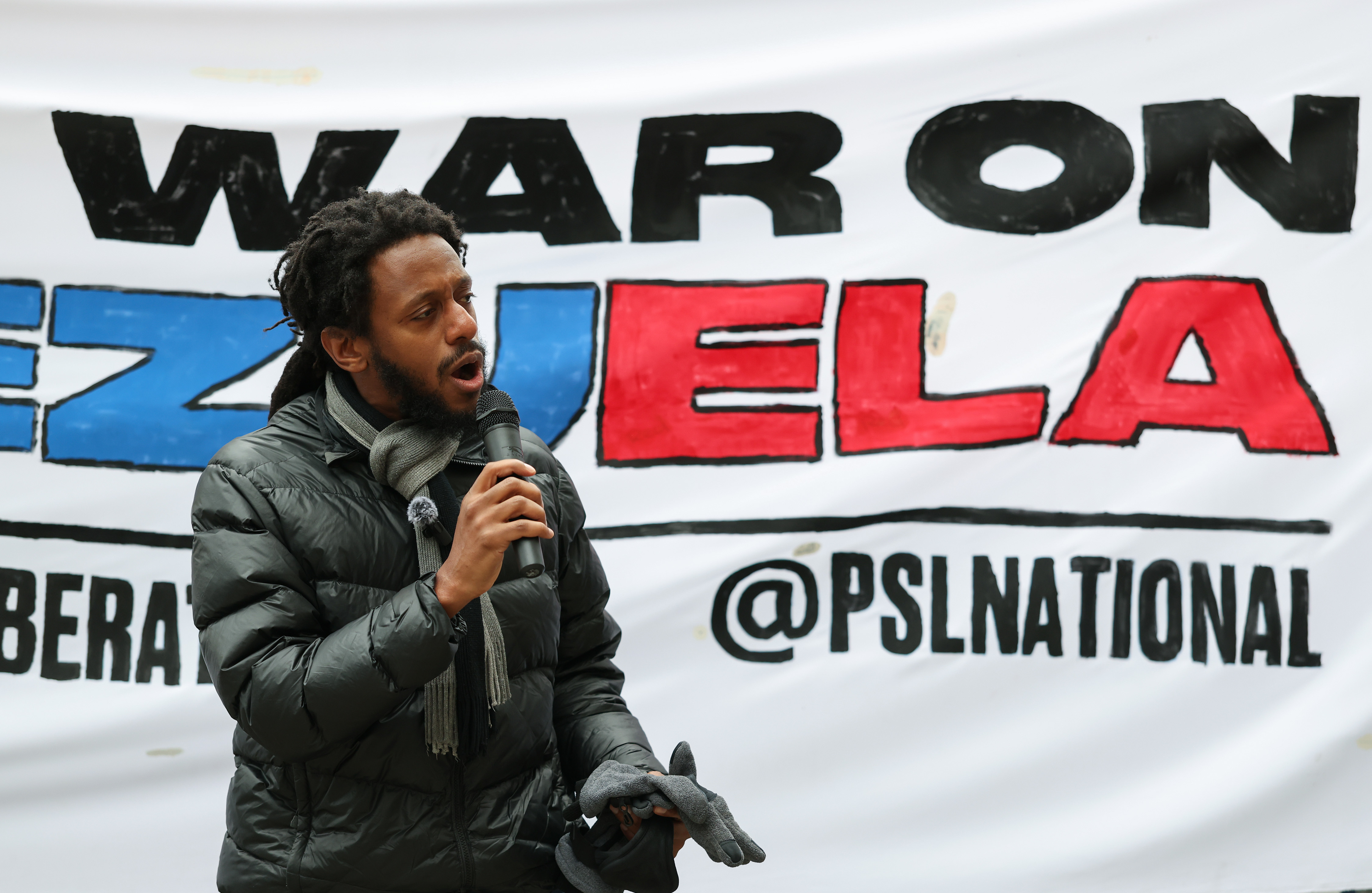 State Sen. Mike Simmons speaks during a demonstration to call...