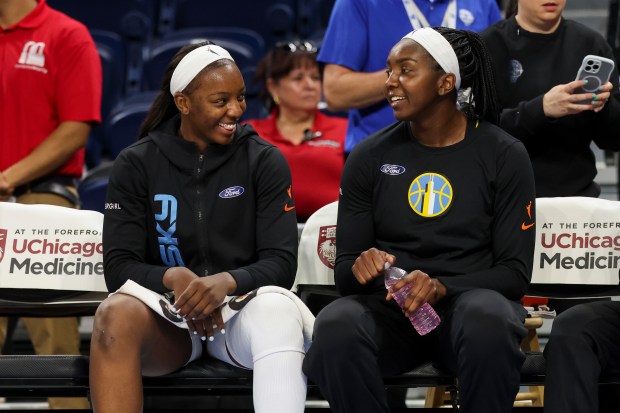 Sky forward Michaela Onyenwere, left, speaks to center Elizabeth Williams before a game against the Atlanta Dream on July 16, 2025, at Wintrust Arena. (Eileen T. Meslar/Chicago Tribune)