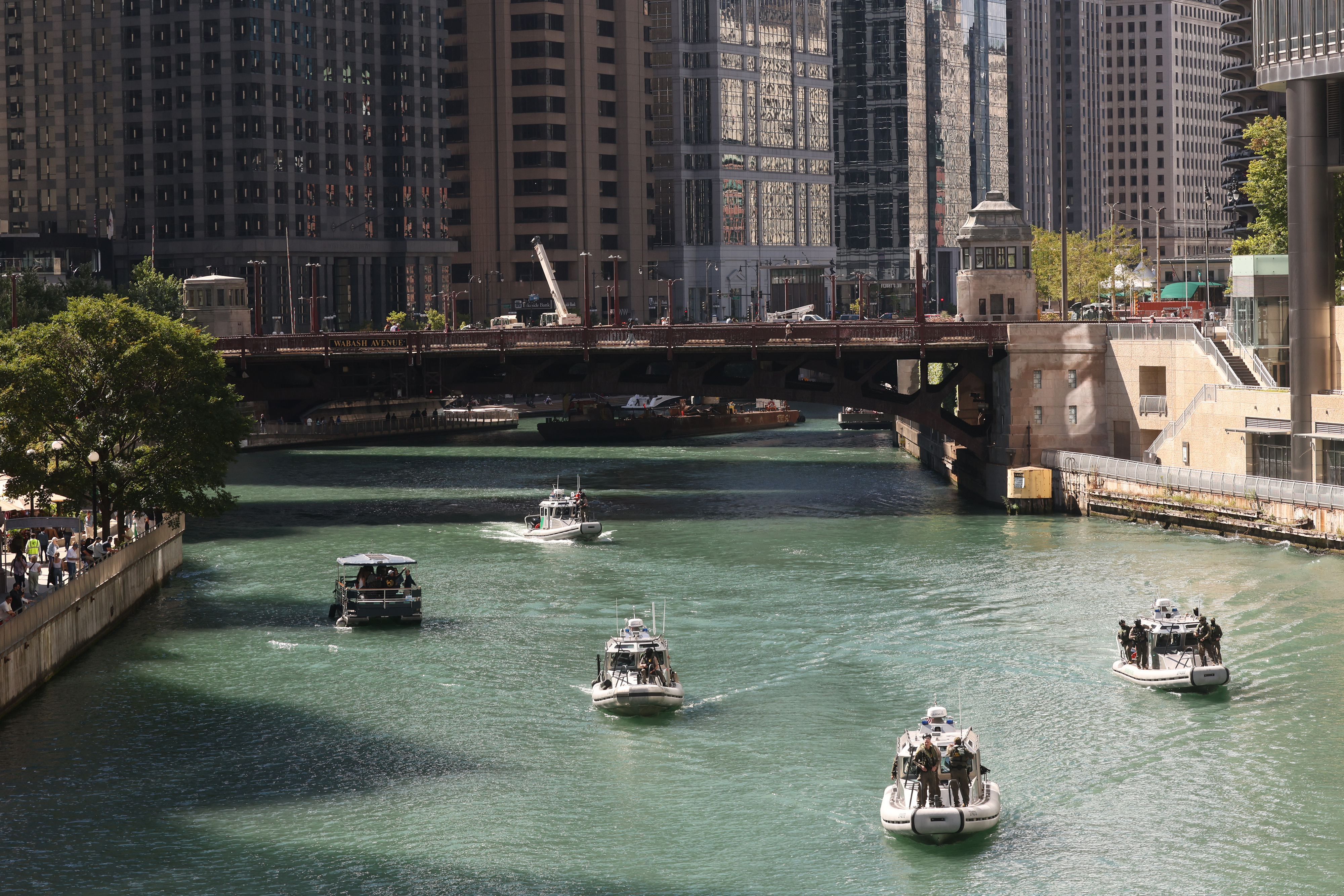 U.S. Customs and Border Protection boats make their way east...