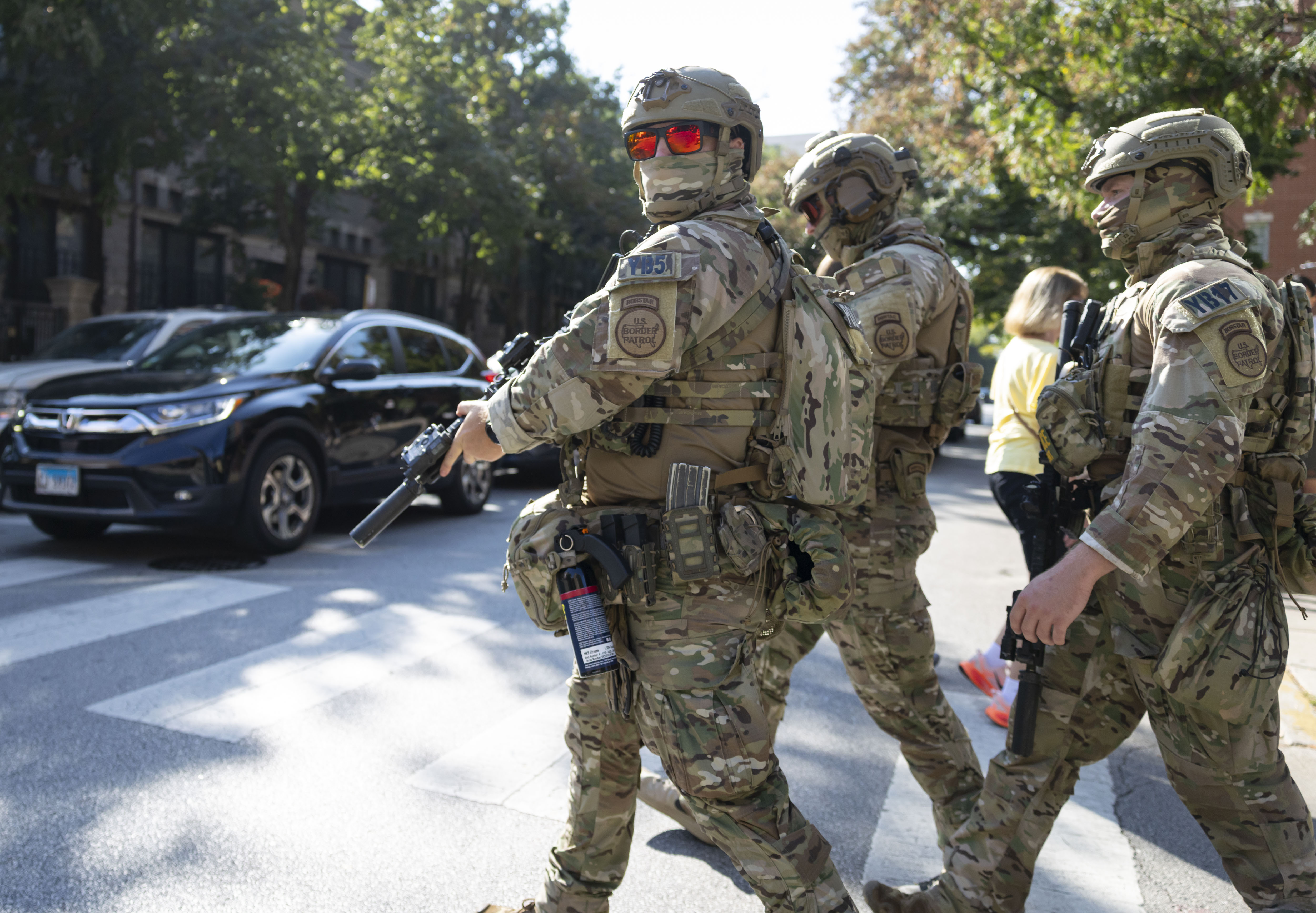 U.S. Border Patrol agents cross the street near the Newberry...