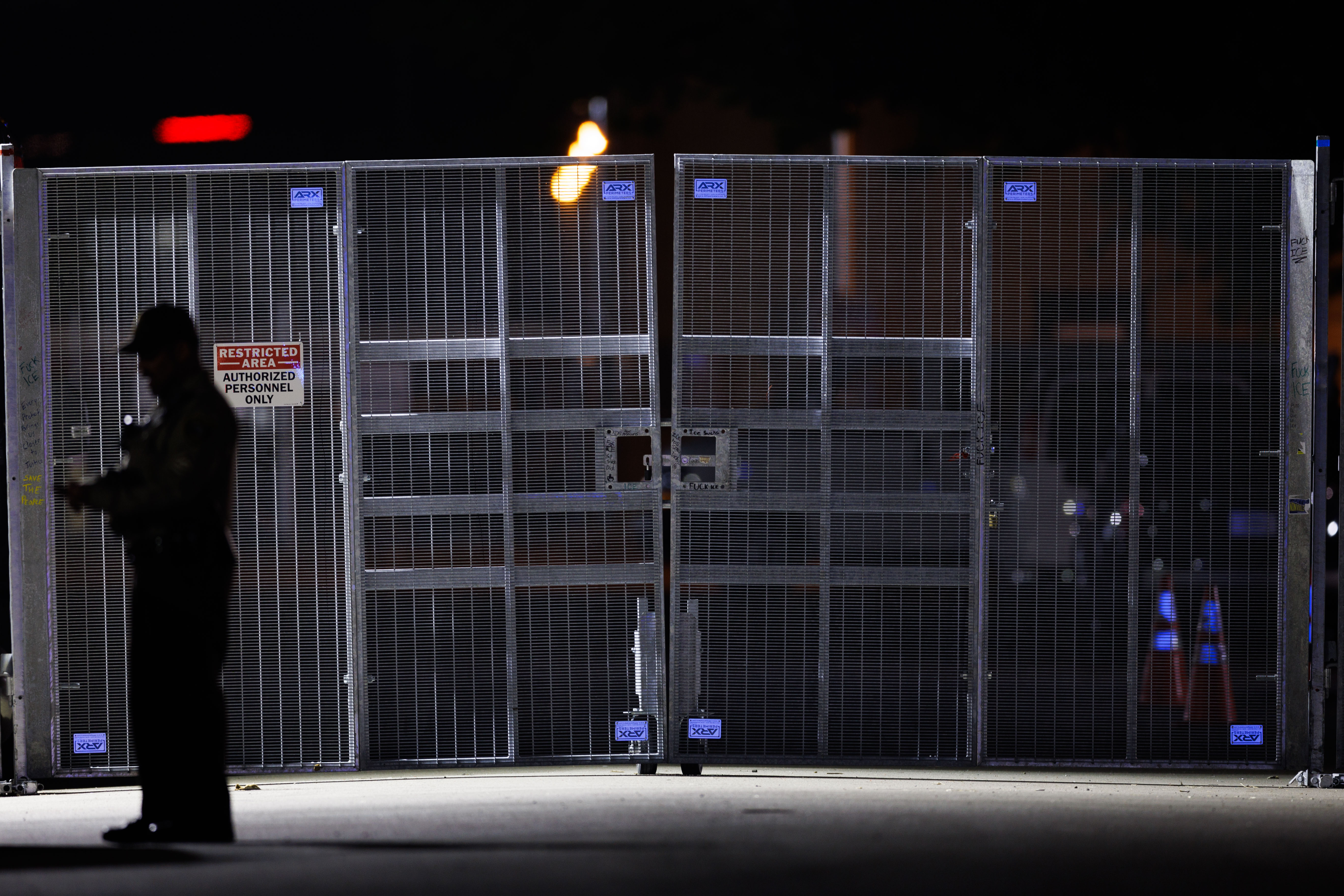 A fence that a federal court has ordered the Trump...