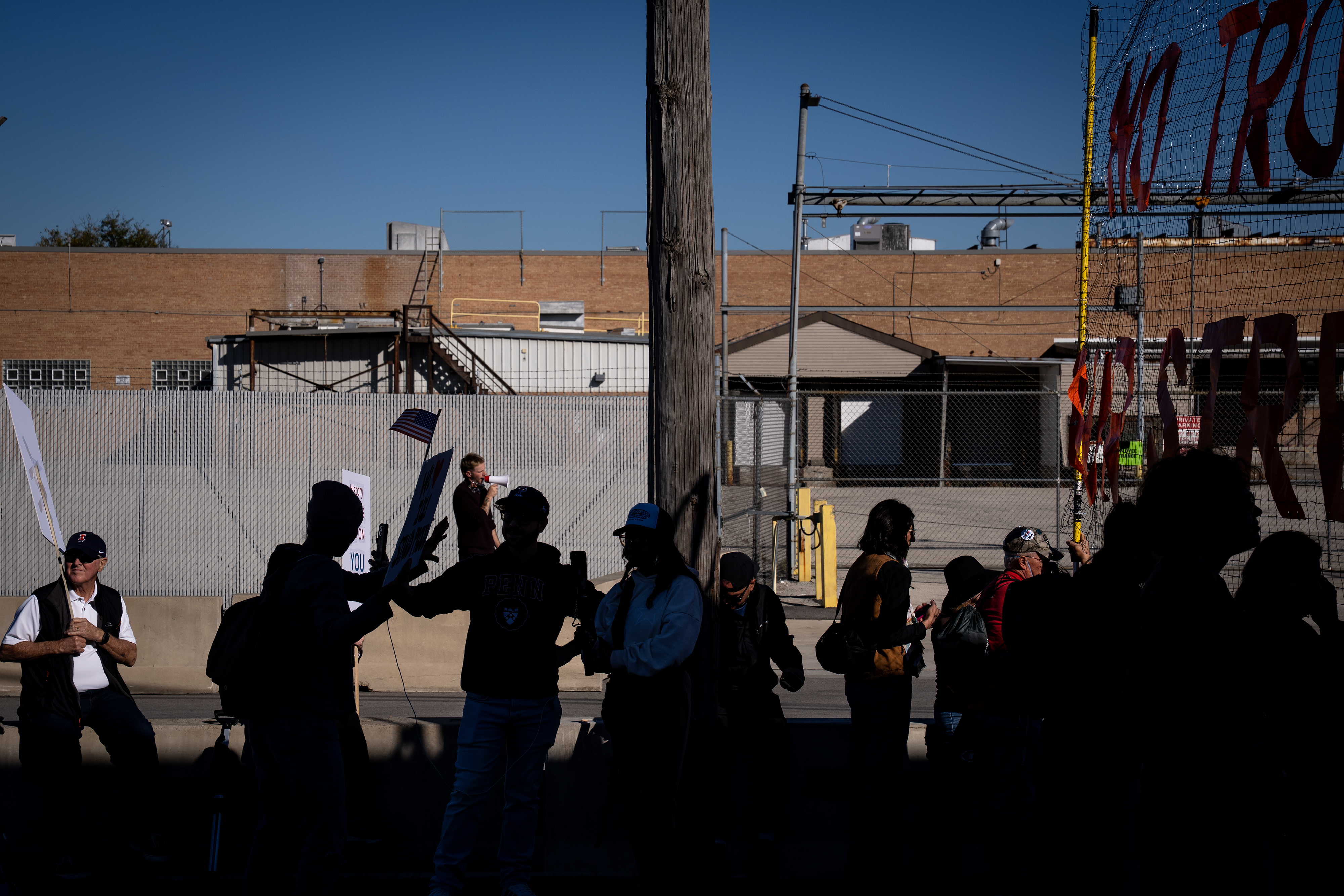Protesters and journalists wait at the U.S. Immigration and Customs...