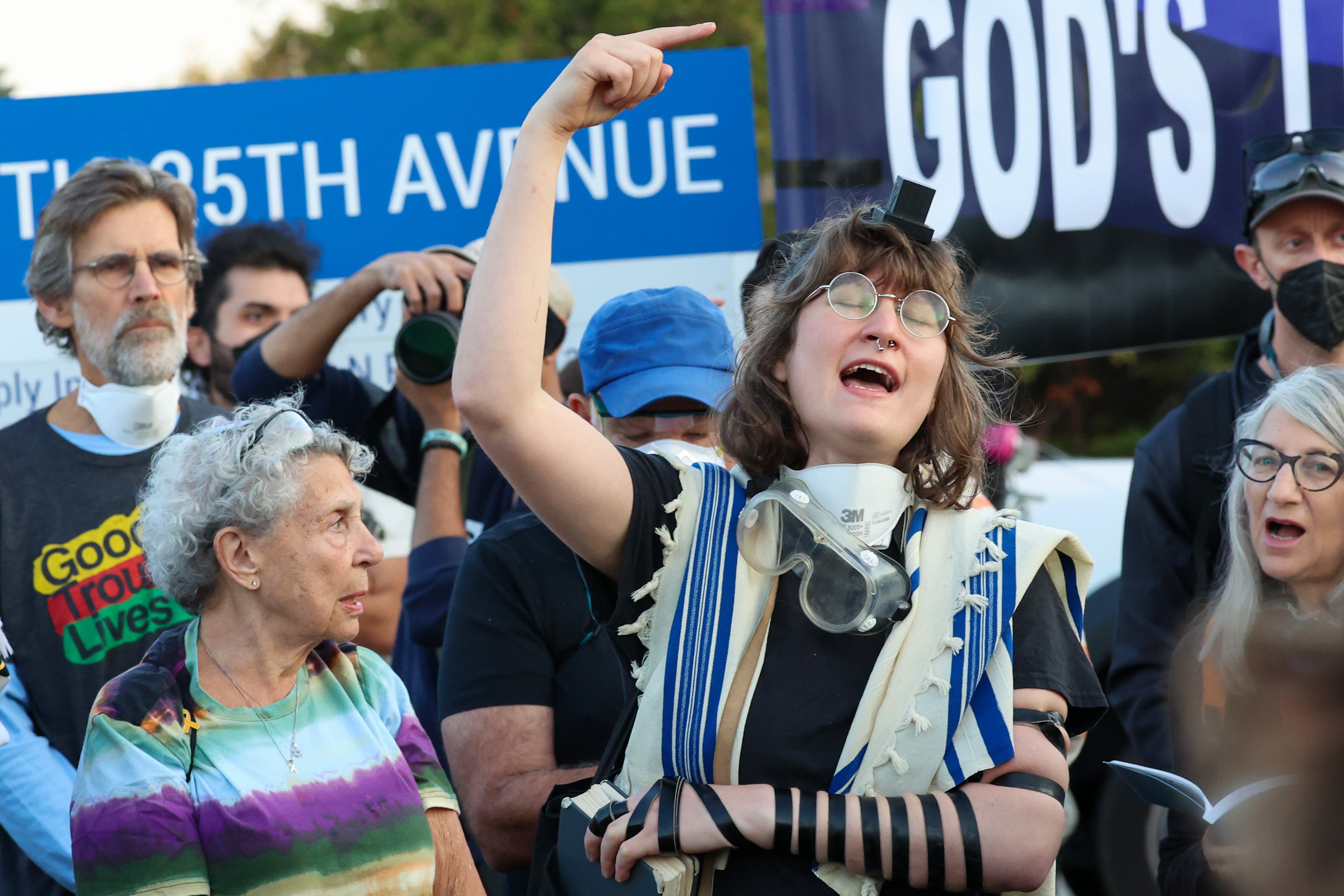 People sing and recite prayers during a Jewish prayer service...
