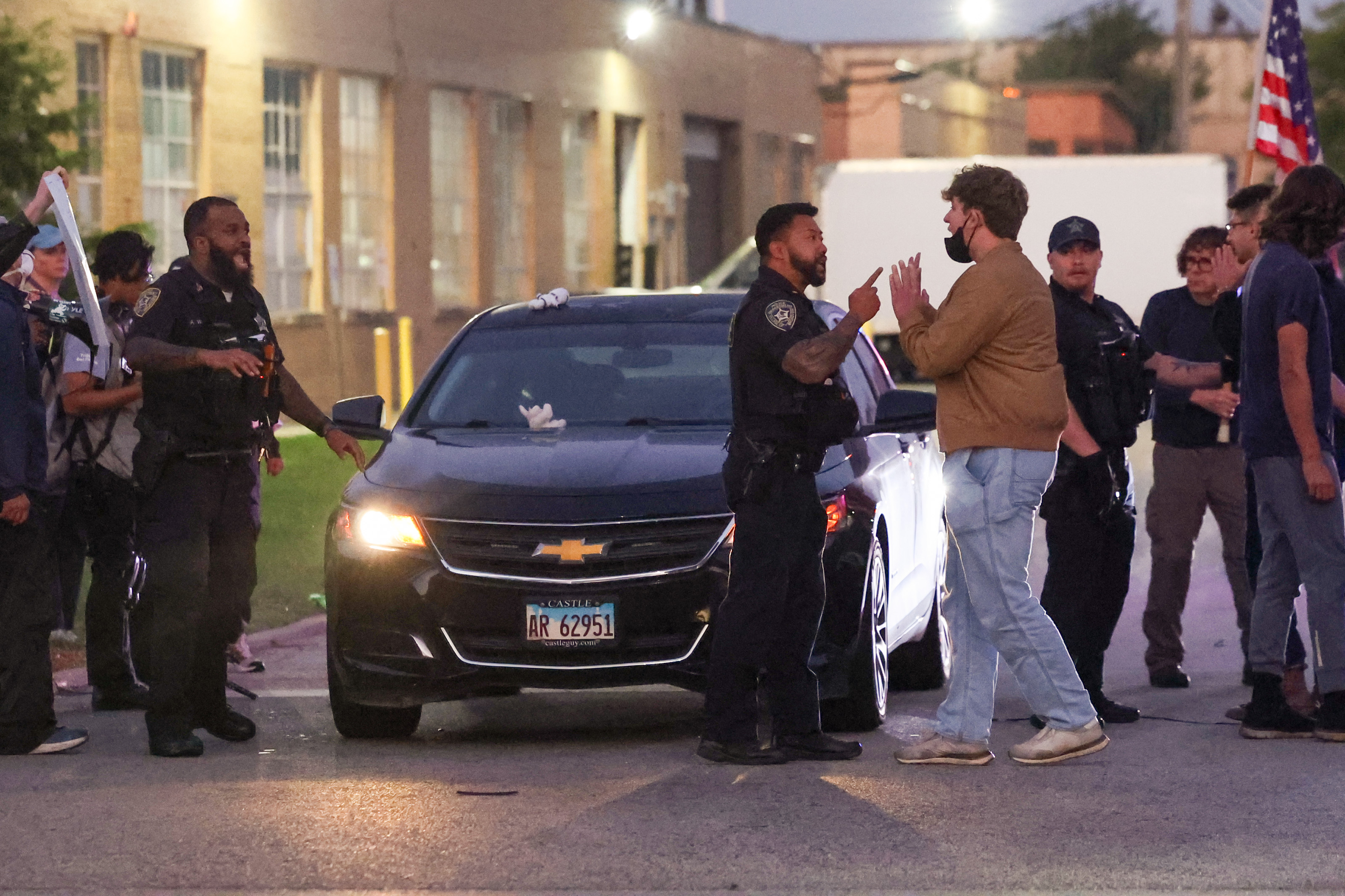 Broadview police officers move protesters as they try and clear...