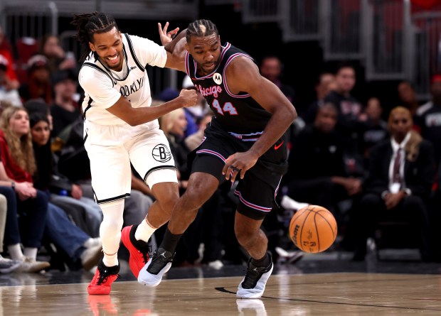 Chicago Bulls forward Patrick Williams (right) steals the ball from Brooklyn Nets forward Ziaire Williams (1) in the first half of a game at the United Center in Chicago on Dec. 3, 2025. (Chris Sweda/Chicago Tribune)
