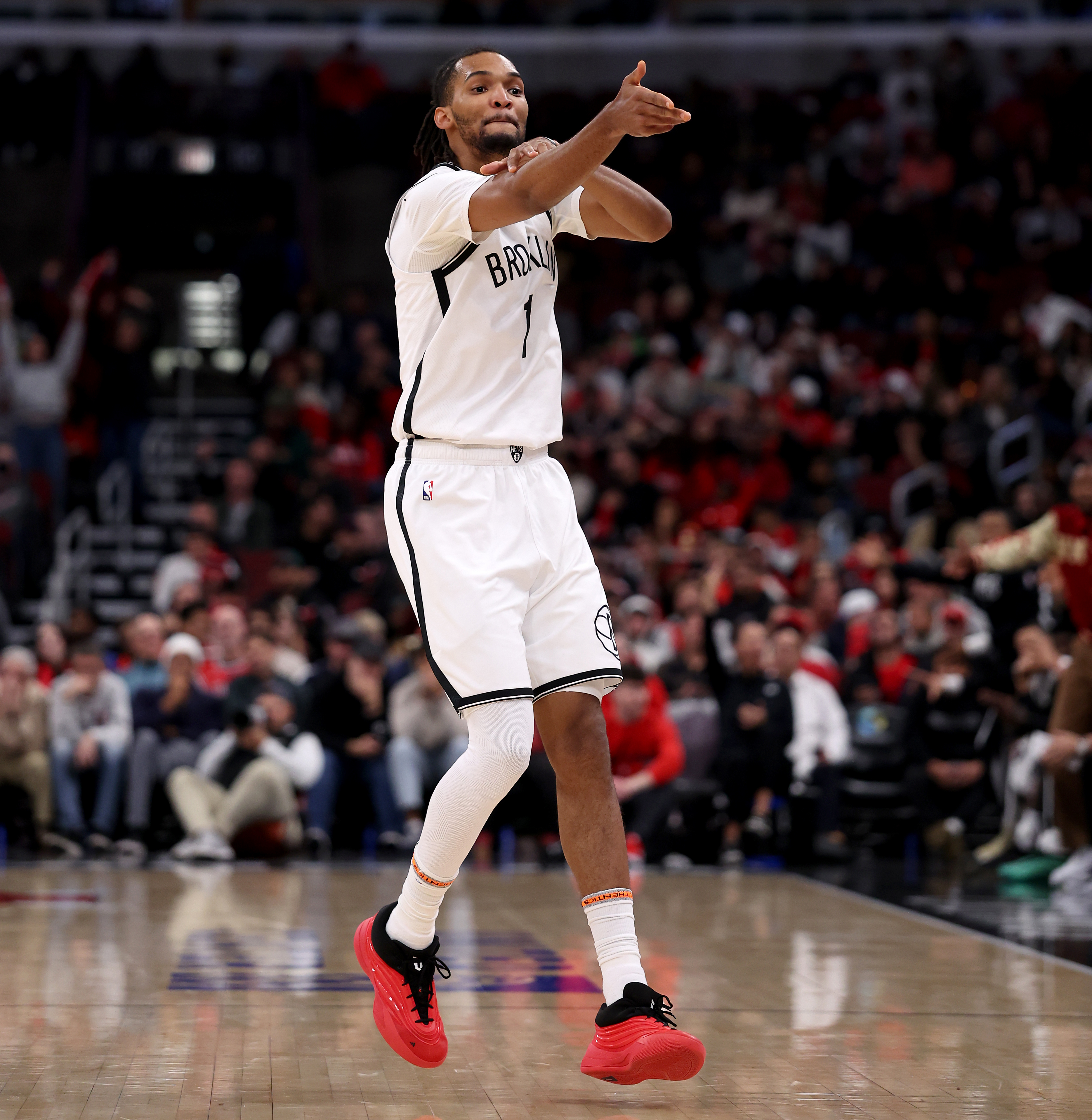 Brooklyn Nets forward Ziaire Williams (1) gestures toward the Chicago Bulls bench after hitting a 3-pointer in the second half of a game at the United Center in Chicago on Dec. 3, 2025. Williams was called for a technical foul for the gesture. (Chris Sweda/Chicago Tribune)
