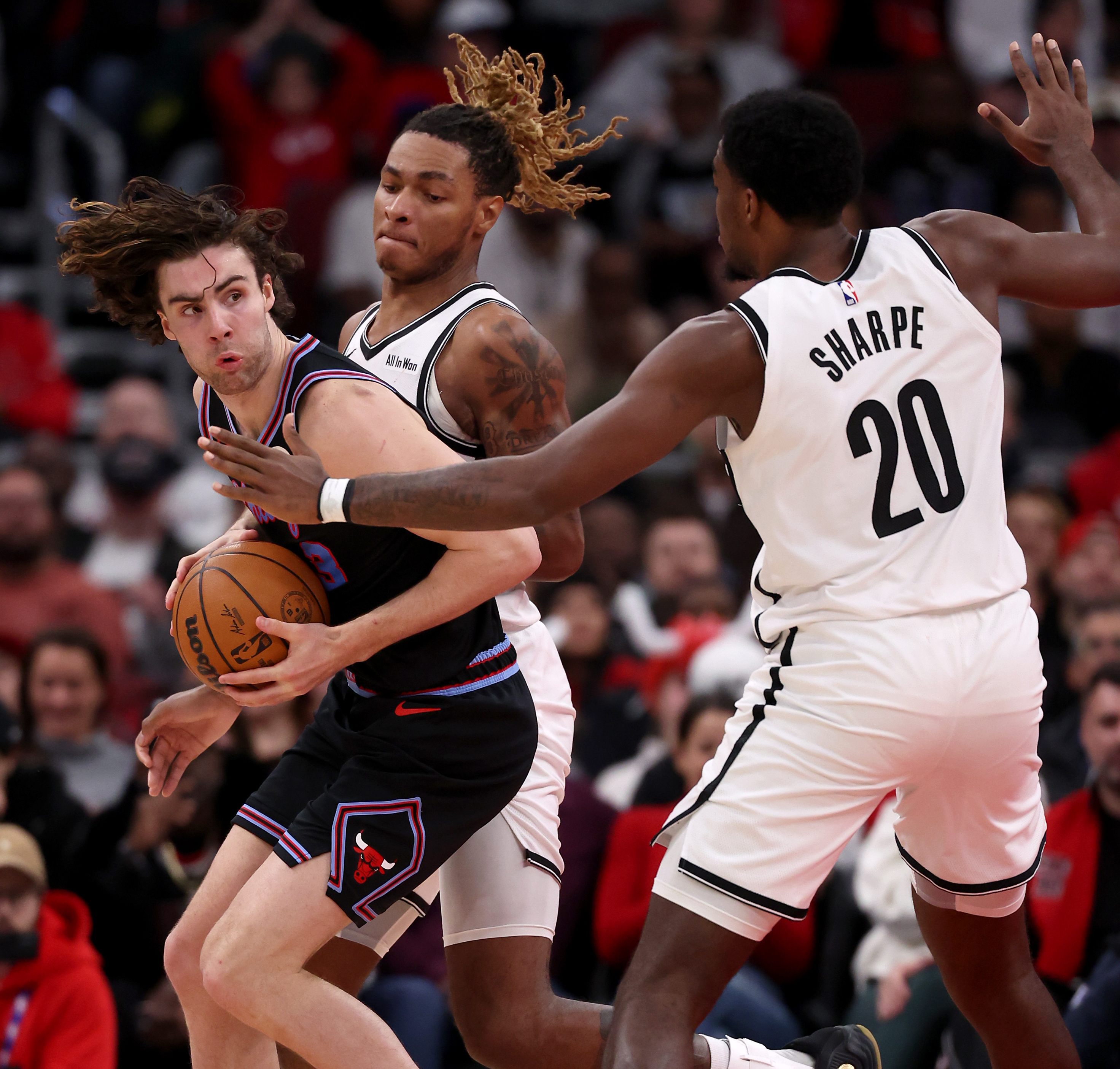 Chicago Bulls guard Josh Giddey (3) feels pressure from the Brooklyn Nets defense as he looks for an open teammate in the second half of a game at the United Center in Chicago on Dec. 3, 2025. (Chris Sweda/Chicago Tribune)
