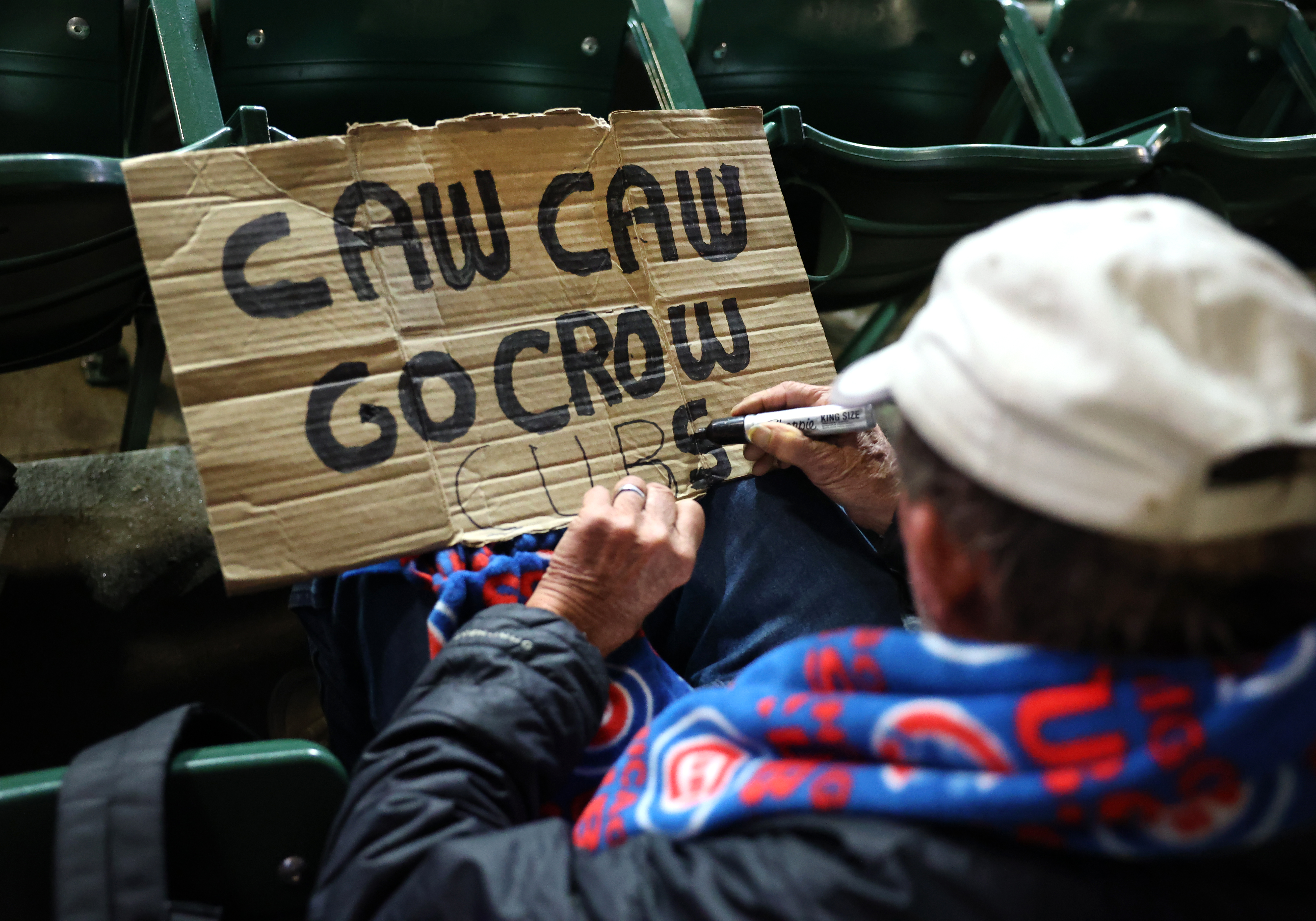 A Pete Crow-Armstrong fan makes a sign in the stands...