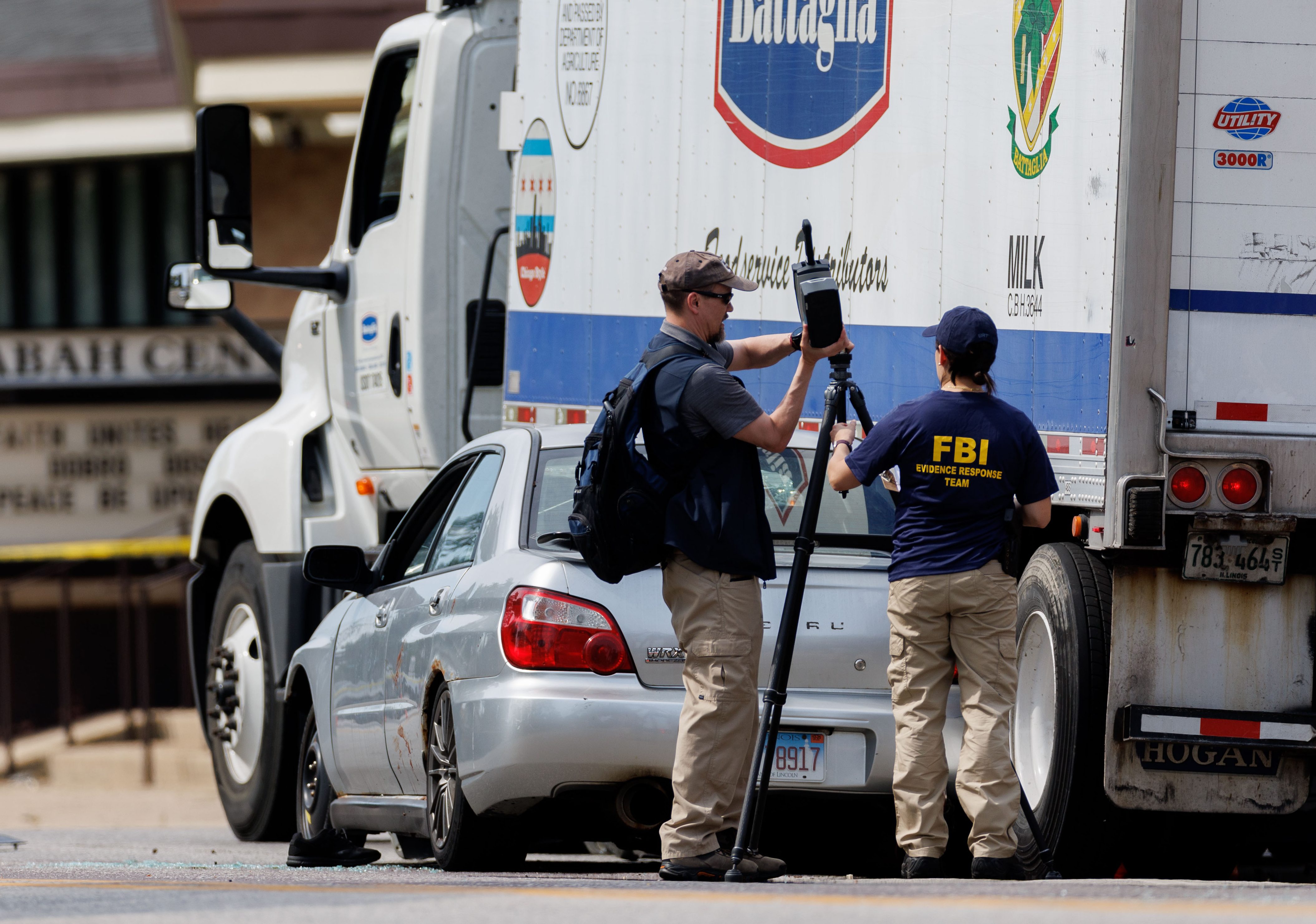 Federal Bureau of Investigation and other law enforcement officers investigate...