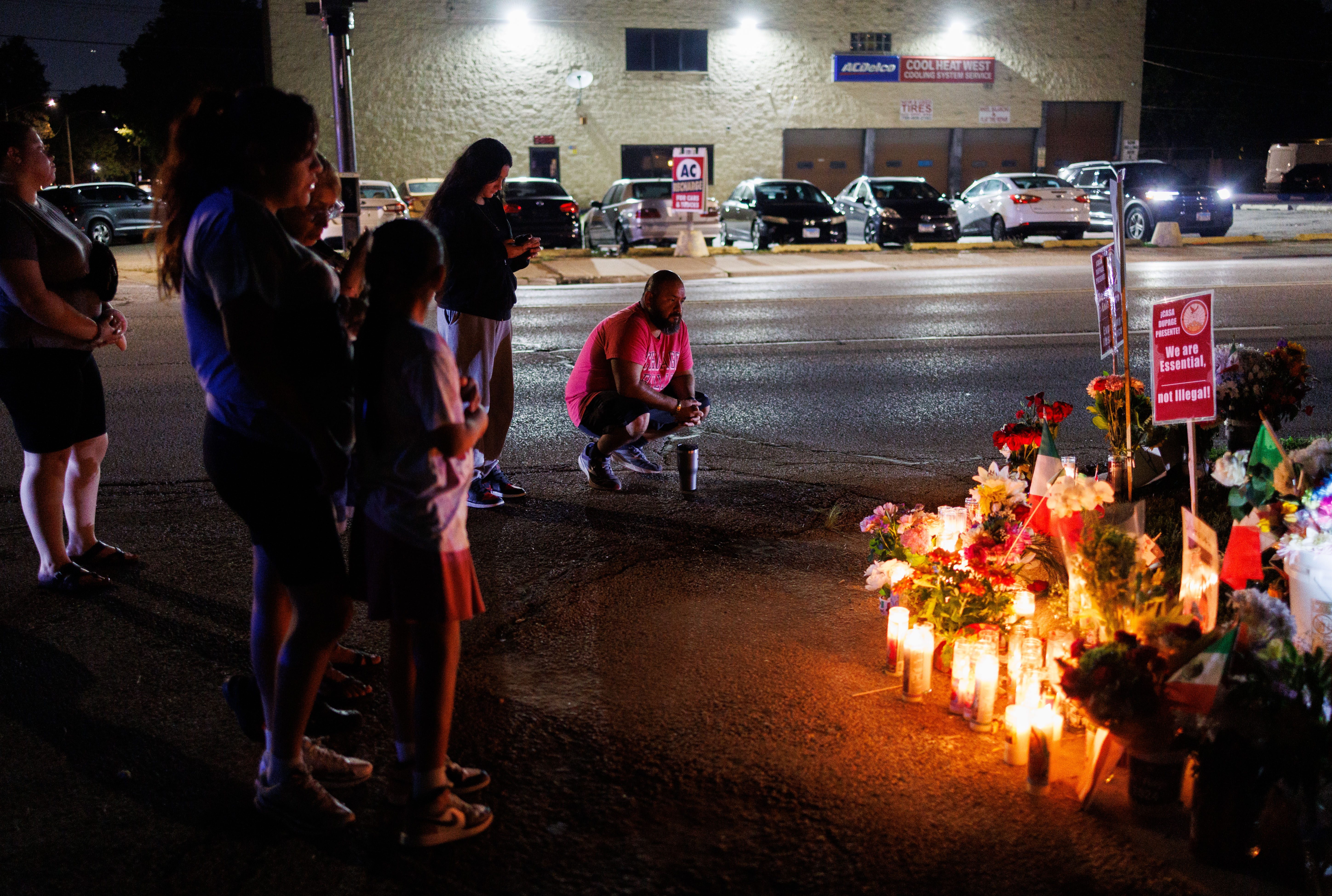 People gather near a memorial for Silverio Villegas GonzÃ¡lez, who...