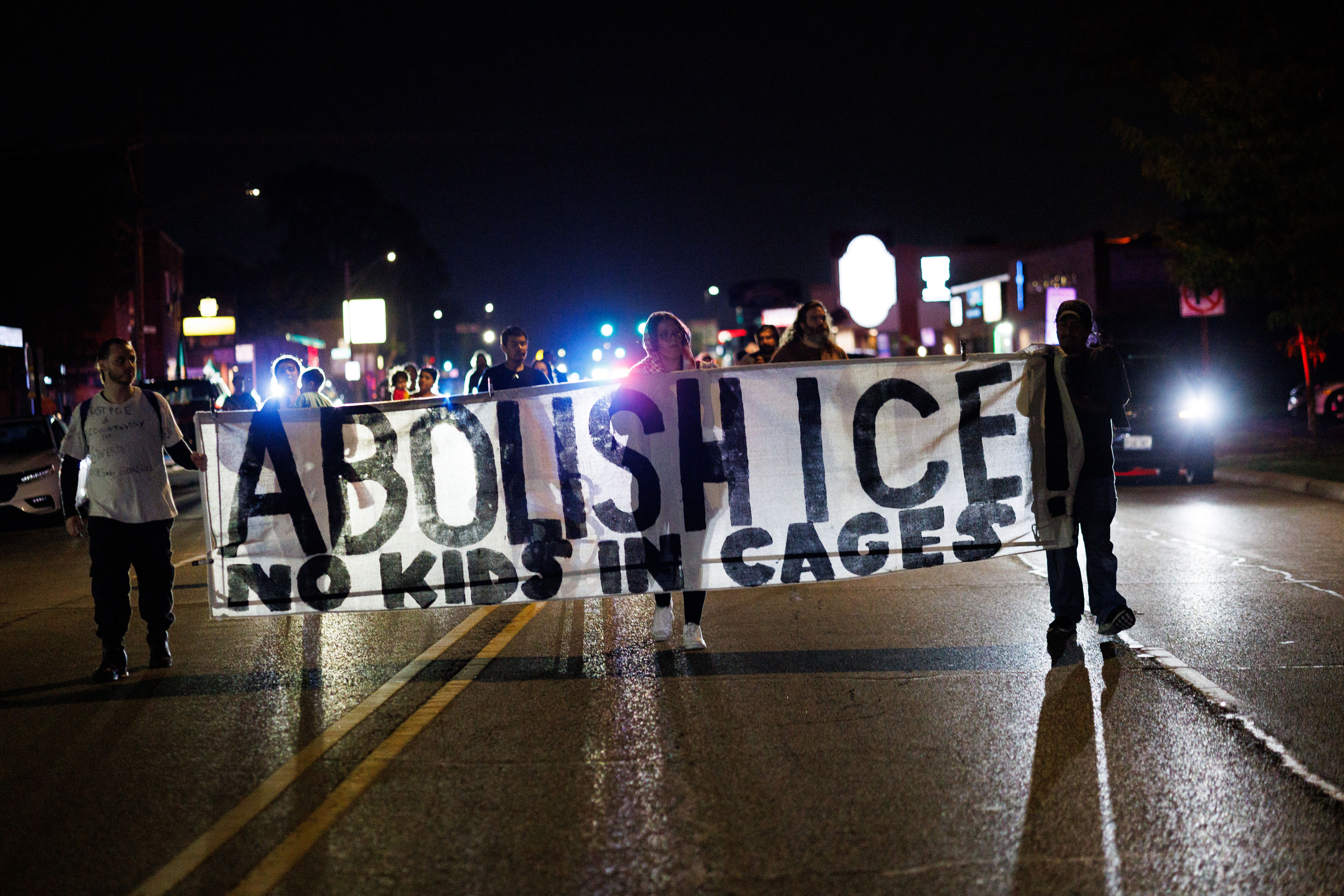 People march down West Grand Avenue in Franklin Park, Sept....
