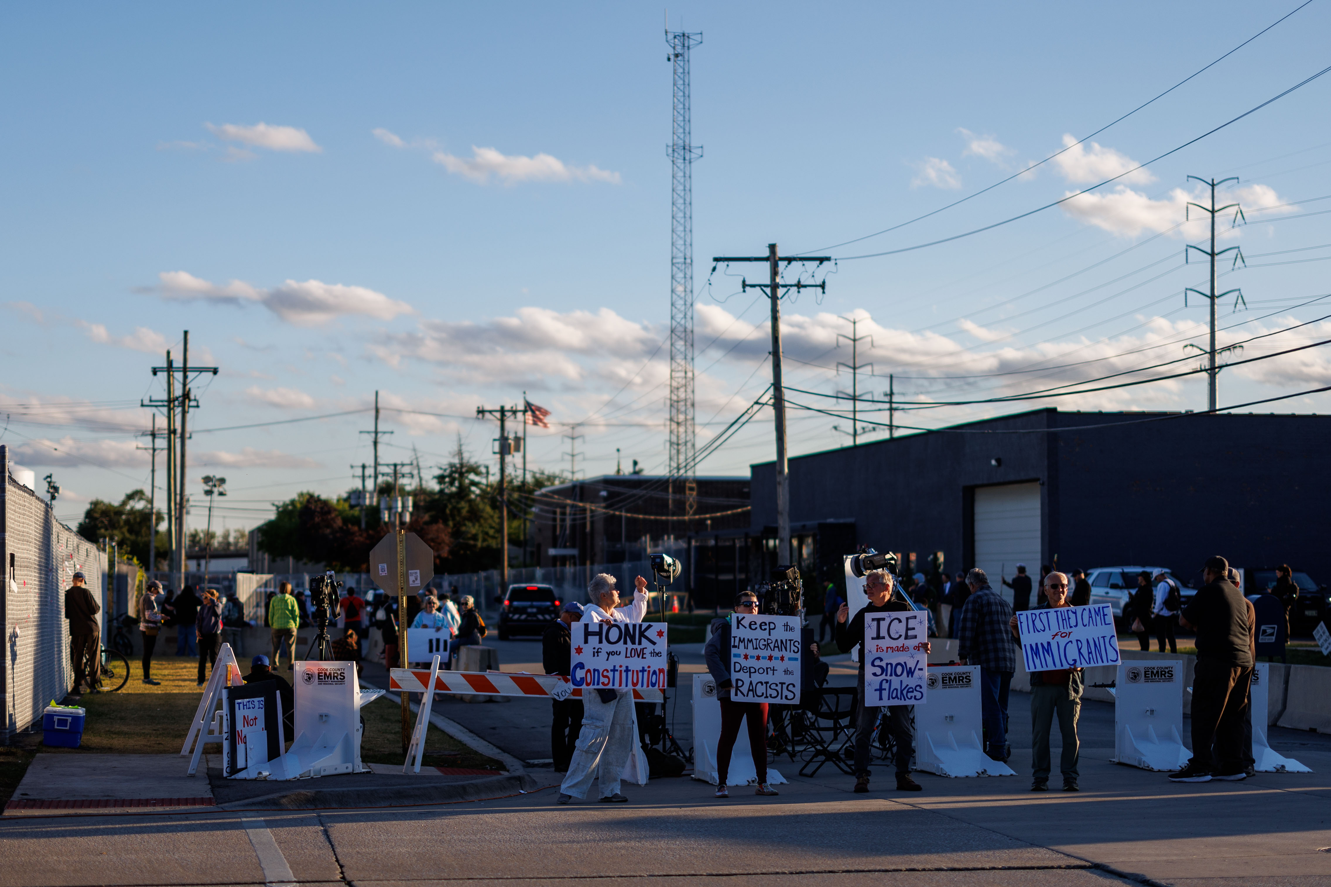 Protesters gather outside the U.S. Immigration and Customs Enforcement holding...