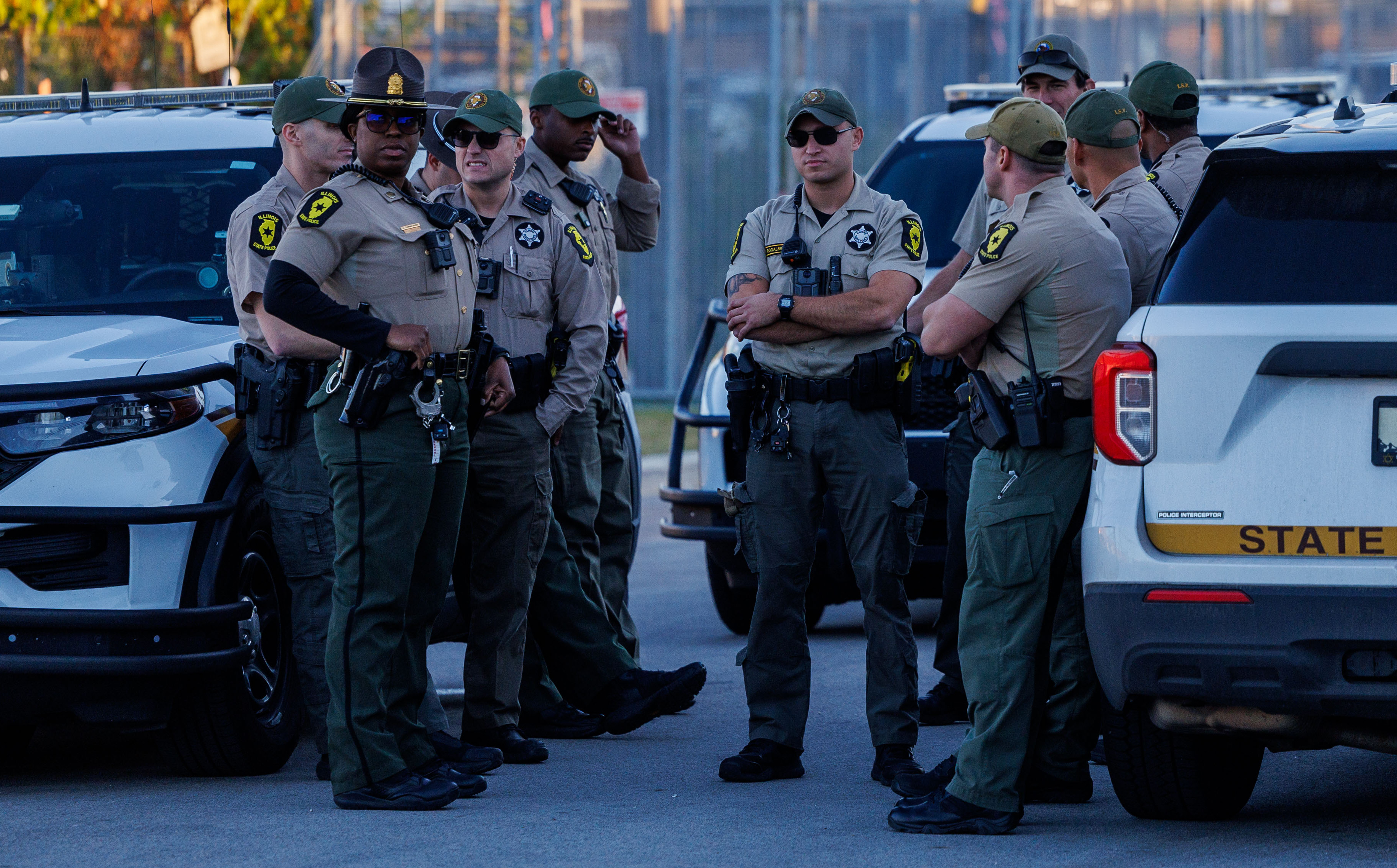 State police troopers stand outside the U.S. Immigration and Customs...