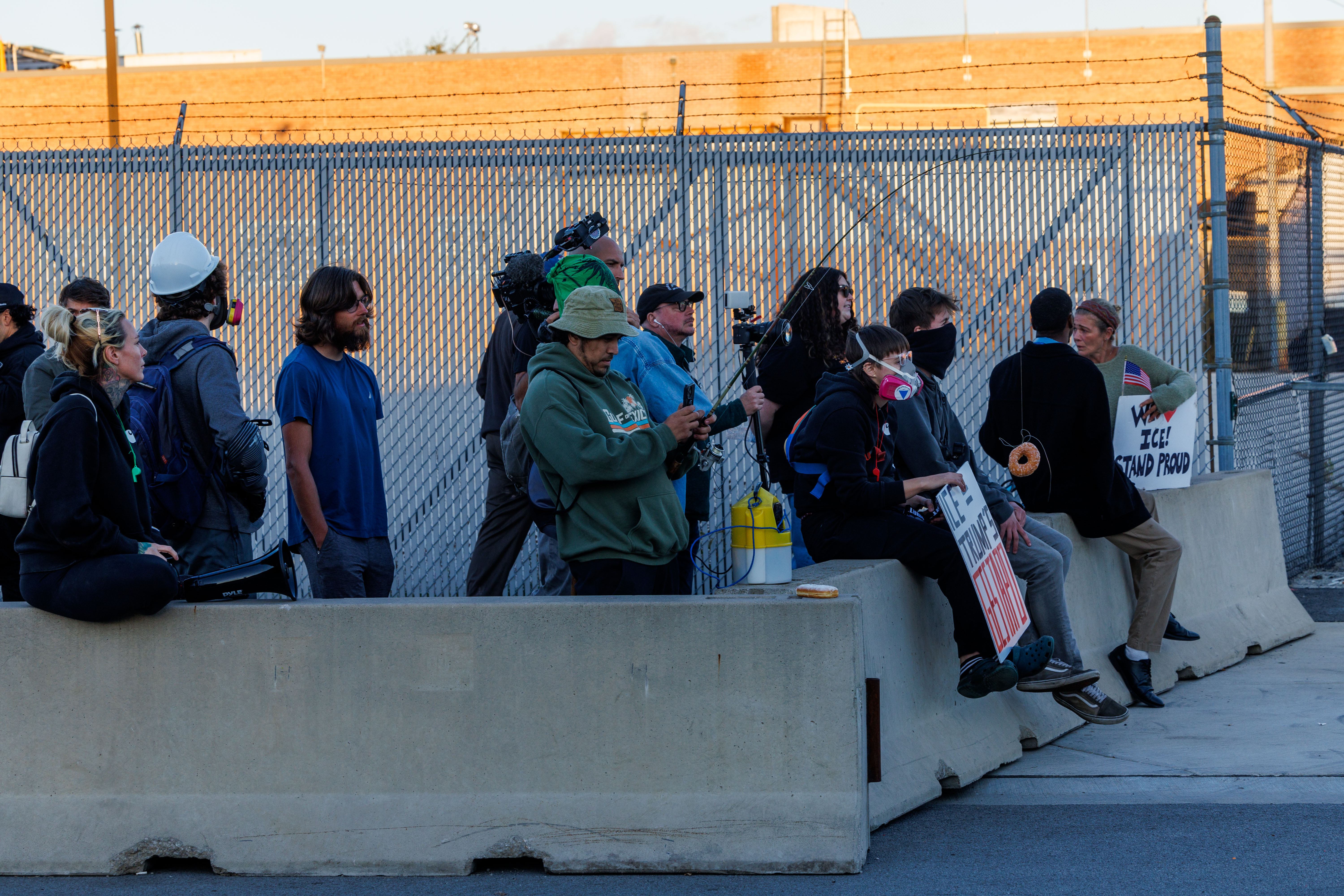 Protesters gather outside the U.S. Immigration and Customs Enforcement holding...