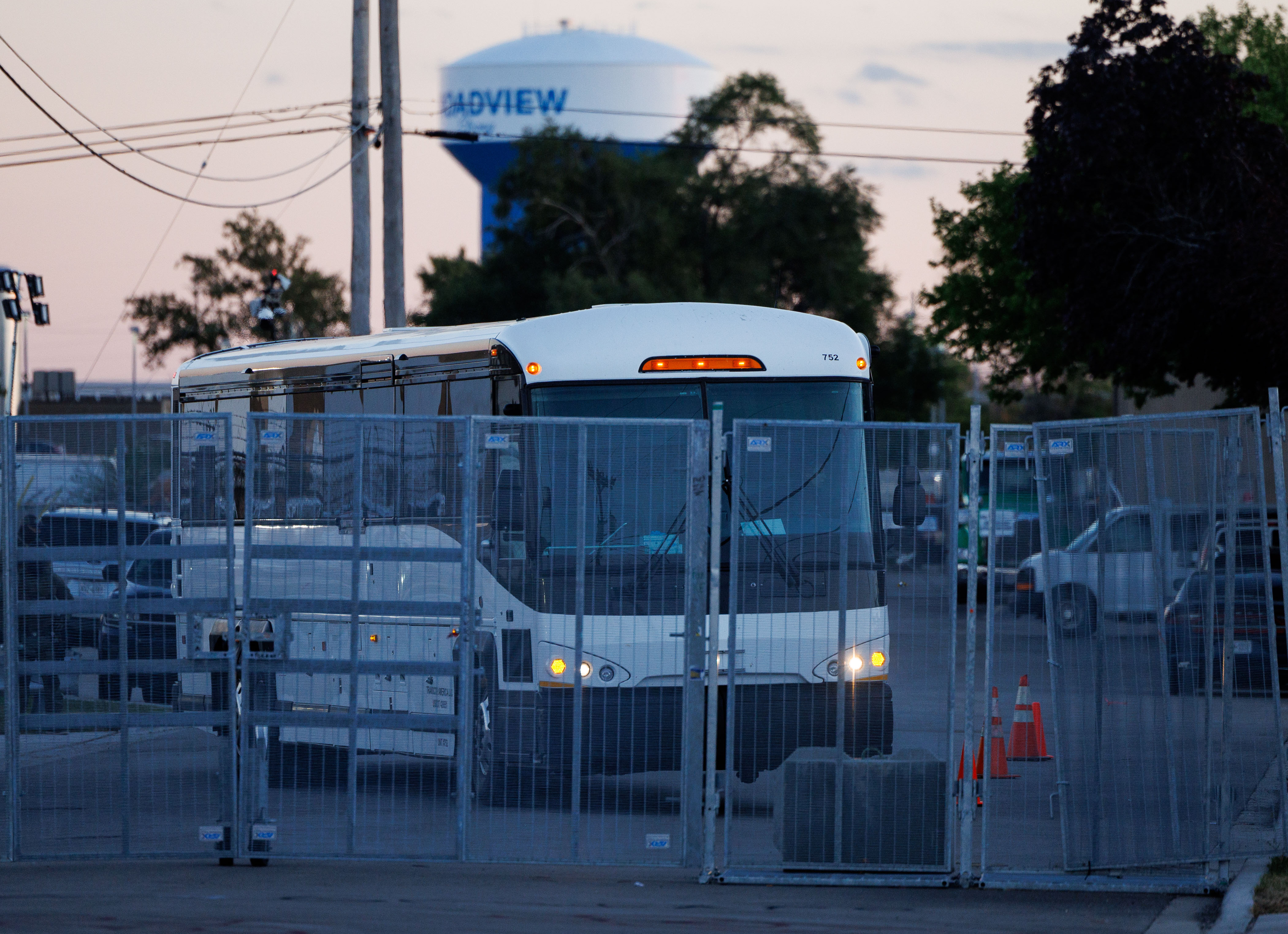 A large bus arrives at the U.S. Immigration and Customs...