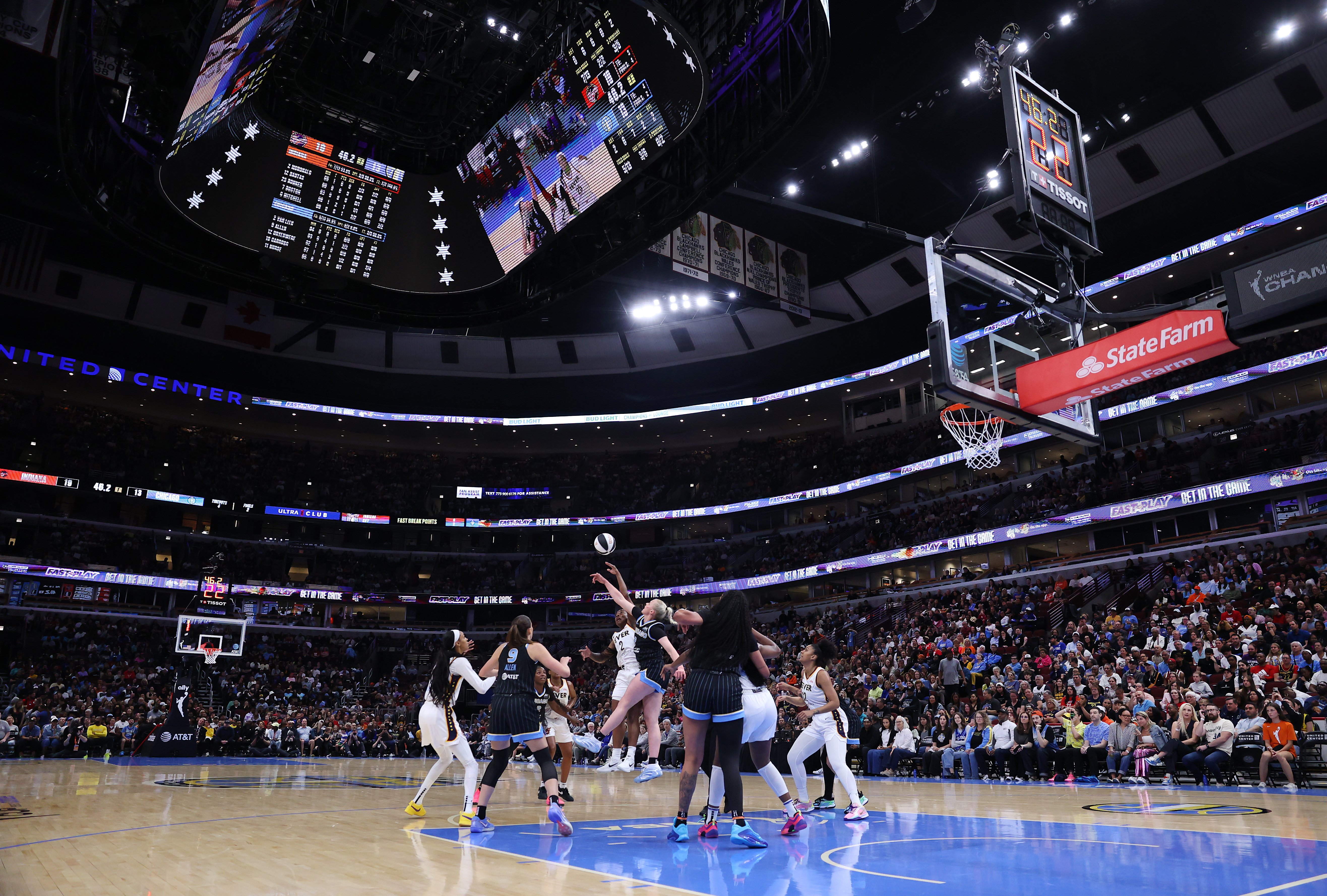 Fever guard Aari McDonald and Sky guard Hailey Van Lith...