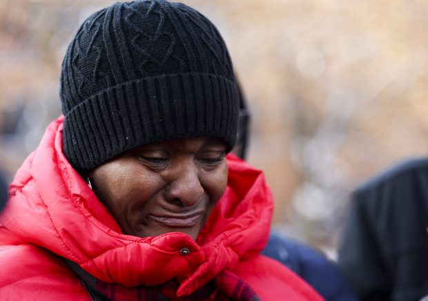 Resident Samantha Stamps cries during a press conference with the 7500 South Shore Tenants Union in front of the apartment building in Chicago on Dec. 2, 2025. (Eileen T. Meslar/Chicago Tribune)