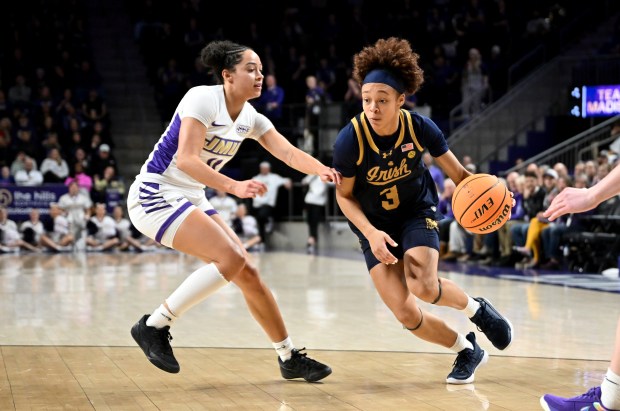 Notre Dame's Hannah Hidalgo handles the ball against James Madison's Bree Robinson on Dec. 14, 2025, in Harrisonburg, Va. (Greg Fiume/Getty Images)