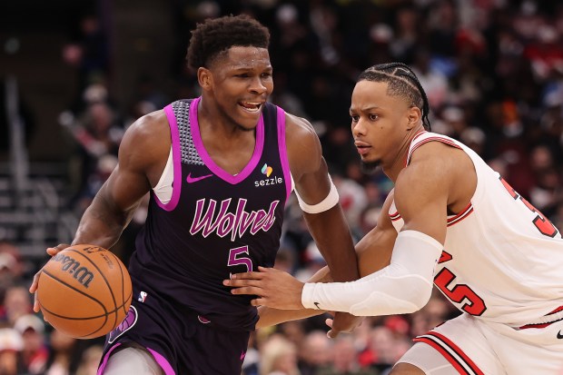 CHICAGO, ILLINOIS - DECEMBER 29: Anthony Edwards #5 of the Minnesota Timberwolves drives to the basket against Isaac Okoro #35 of the Chicago Bulls during the second half at the United Center on December 29, 2025 in Chicago, Illinois. NOTE TO USER: User expressly acknowledges and agrees that, by downloading and or using this photograph, User is consenting to the terms and conditions of the Getty Images License Agreement. (Photo by Michael Reaves/Getty Images)
