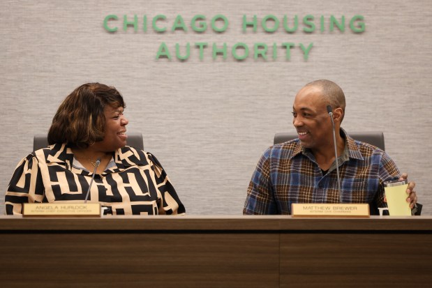 Former Interim Chicago Housing Authority CEO Angela Hurlock, left, and former Interim CHA Chairman Matthew Brewer before CHA called a special board meeting at the CHA headquarters in Chicago on Feb. 20, 2025. The board appointed Brewer interim CEO when Hurlock resigned the post in September. (Audrey Richardson/Chicago Tribune)