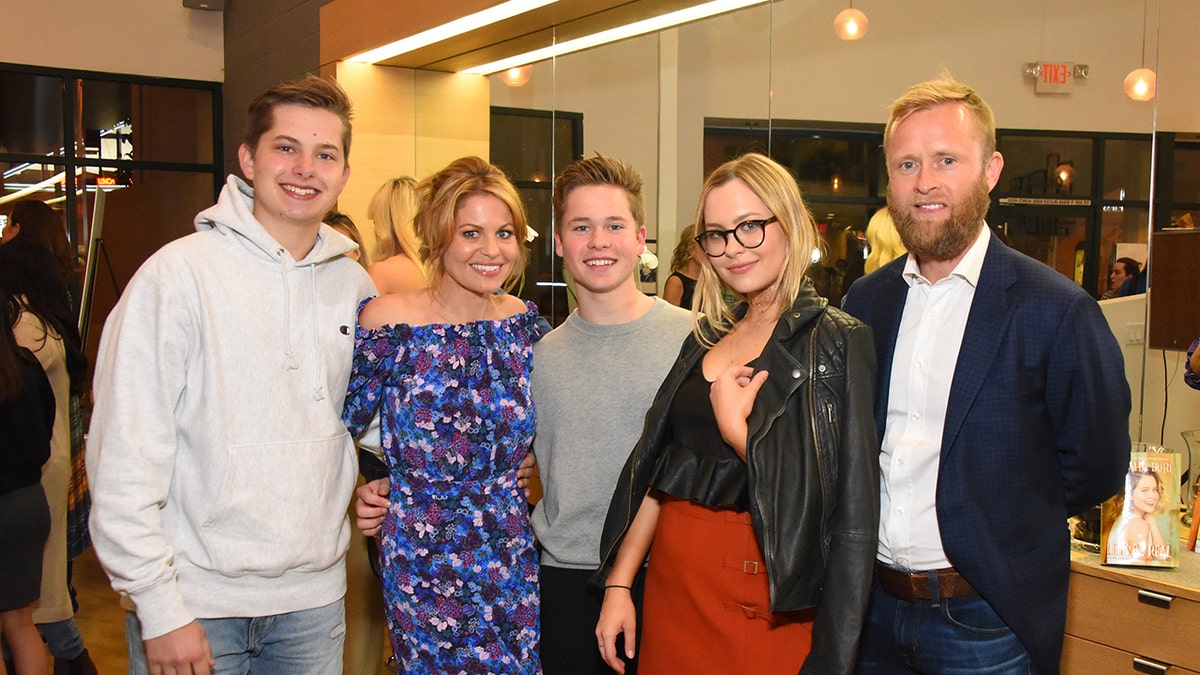 Candace Cameron Bure poses with her family