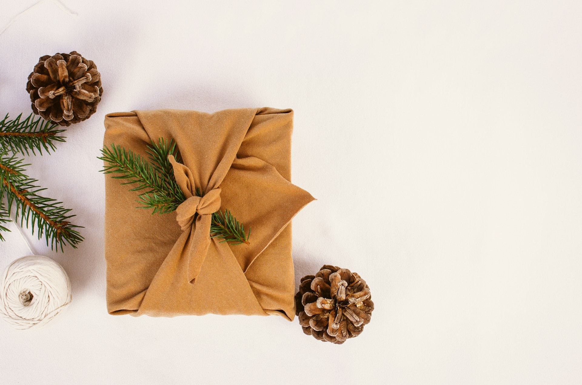 Christmas consumerism: gift wrapped with reusable fabric 