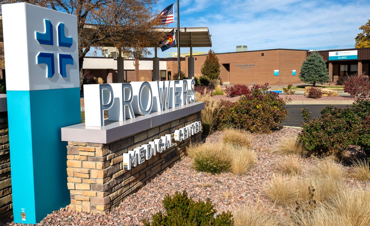Entrance sign for Prowers Medical Center with landscaped grounds and the medical center building visible in the background.