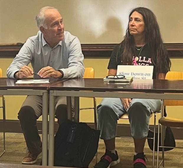 Nautilus Street residents Francis Costello and Mira Sanchez Costello attend the La Jolla Traffic & Transportation Board meeting Sept. 16 to support speed-calming measures. (Noah Lyons)