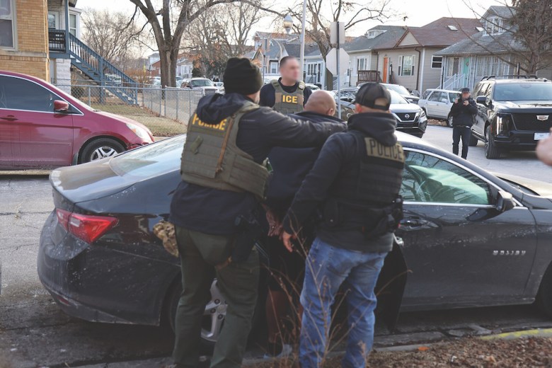 ICE agents arrest a suspect during an enforcement action. 